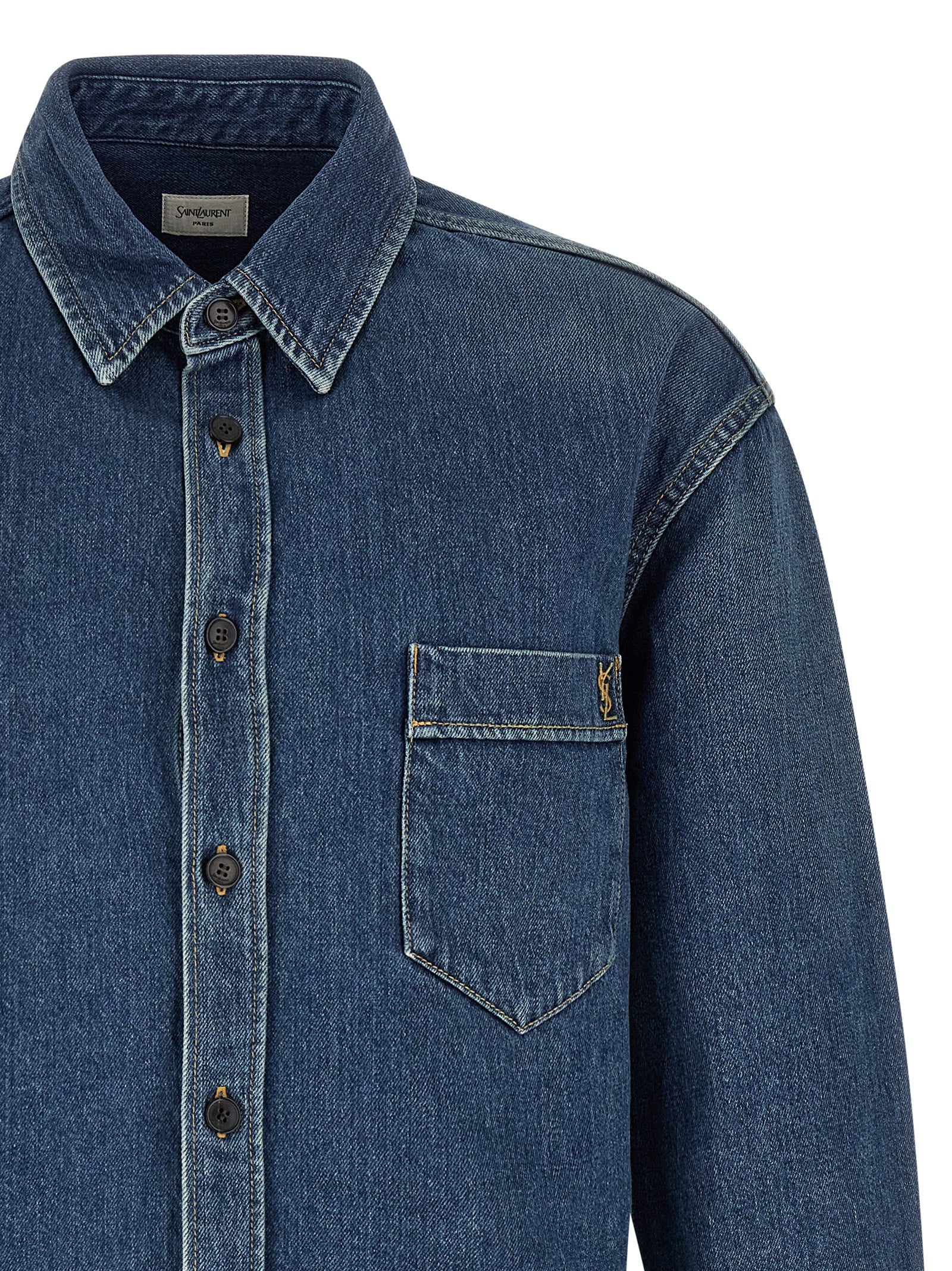 Experience the essence of elegance with the Saint Laurent Blue Cotton Blouse, a masterpiece of craftsmanship in luxurious denim, perfect for the discerning modern individual.