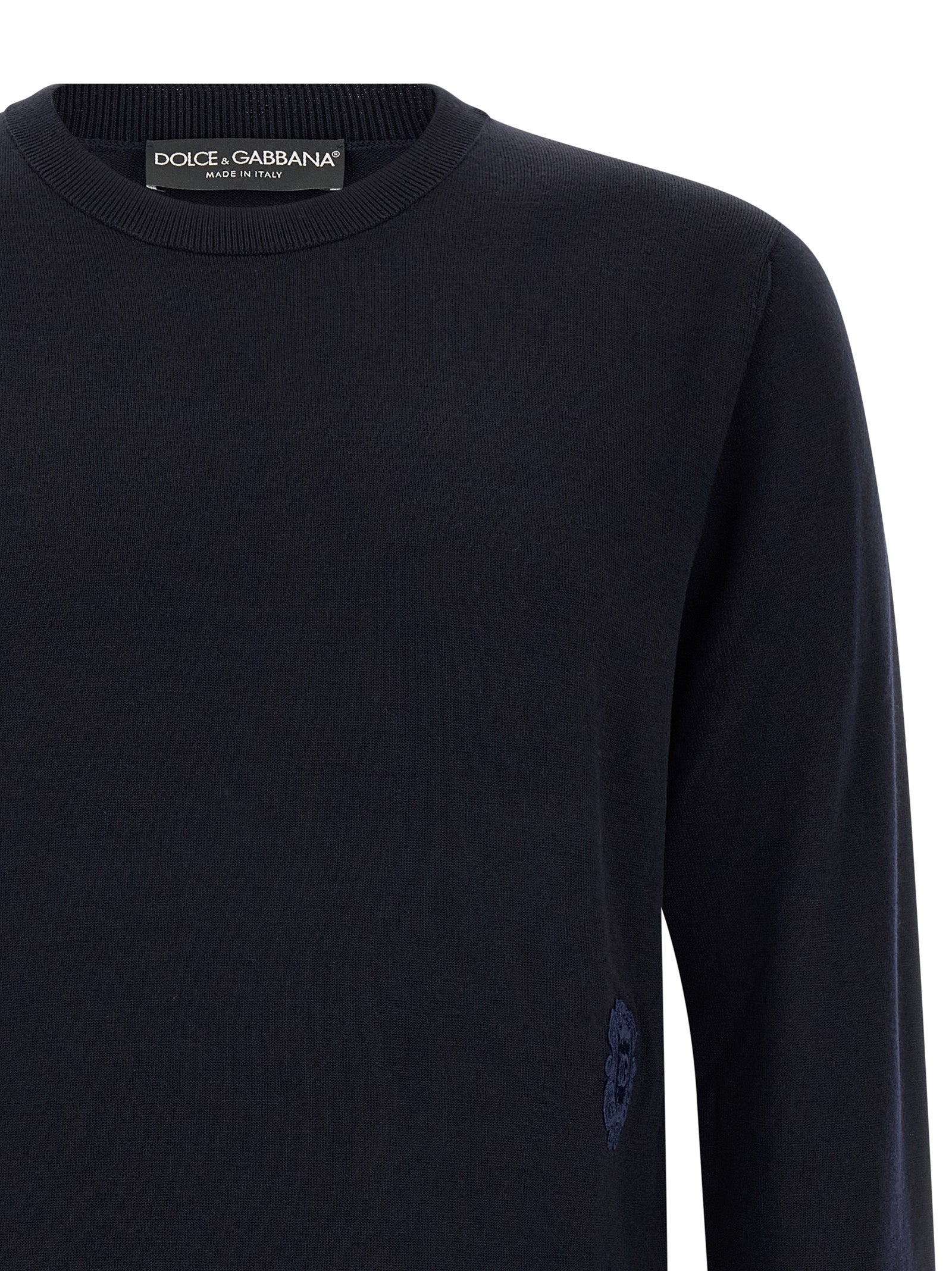 Experience the epitome of sophistication with the Dolce & Gabbana Blue Virgin Wool Cardigan, a luxurious blend of comfort and style, crafted for the discerning individual.