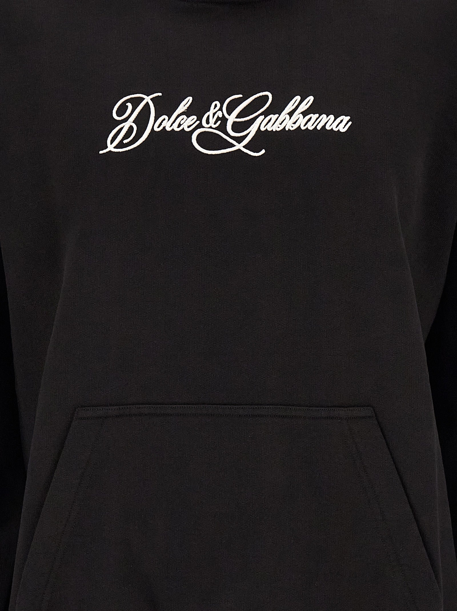 Indulge in the elegance of the Dolce & Gabbana Black Cotton Sweatshirt, a masterpiece of Italian craftsmanship that effortlessly marries comfort with luxurious style.