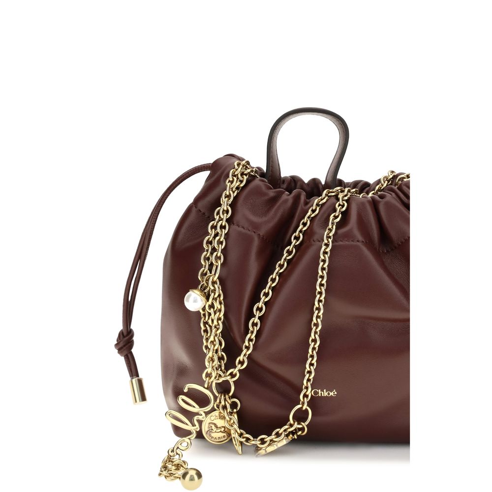 Indulge in the Chloé Bordeaux Calf Leather Bos Taurus Shoulder Bag, a masterpiece of soft lambskin and exquisite craftsmanship, embodying timeless elegance for the discerning connoisseur.