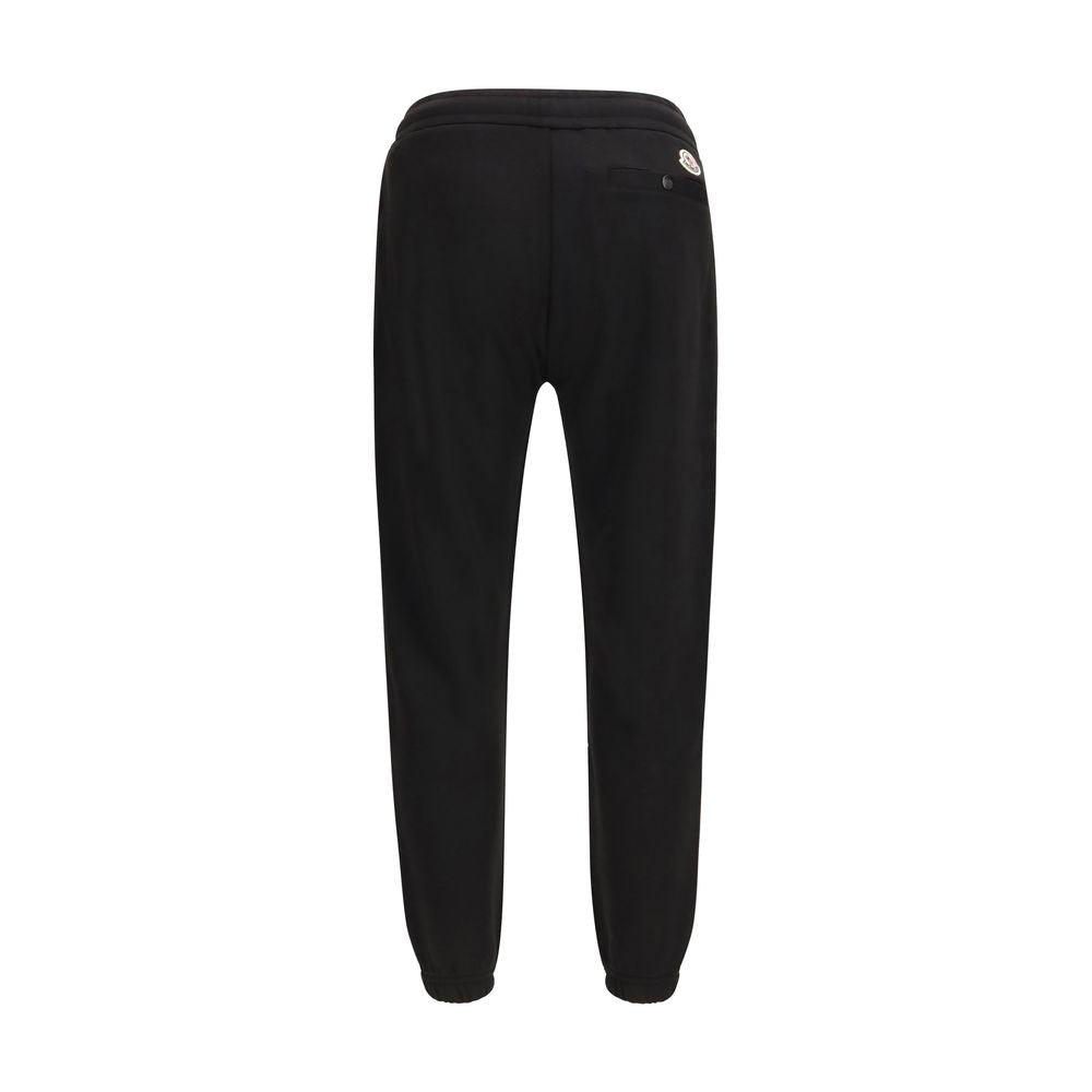 Elevate your loungewear with Moncler Black Cotton Athletic Pants, crafted from a luxurious cotton-blend fleece for unparalleled comfort and sophistication.
