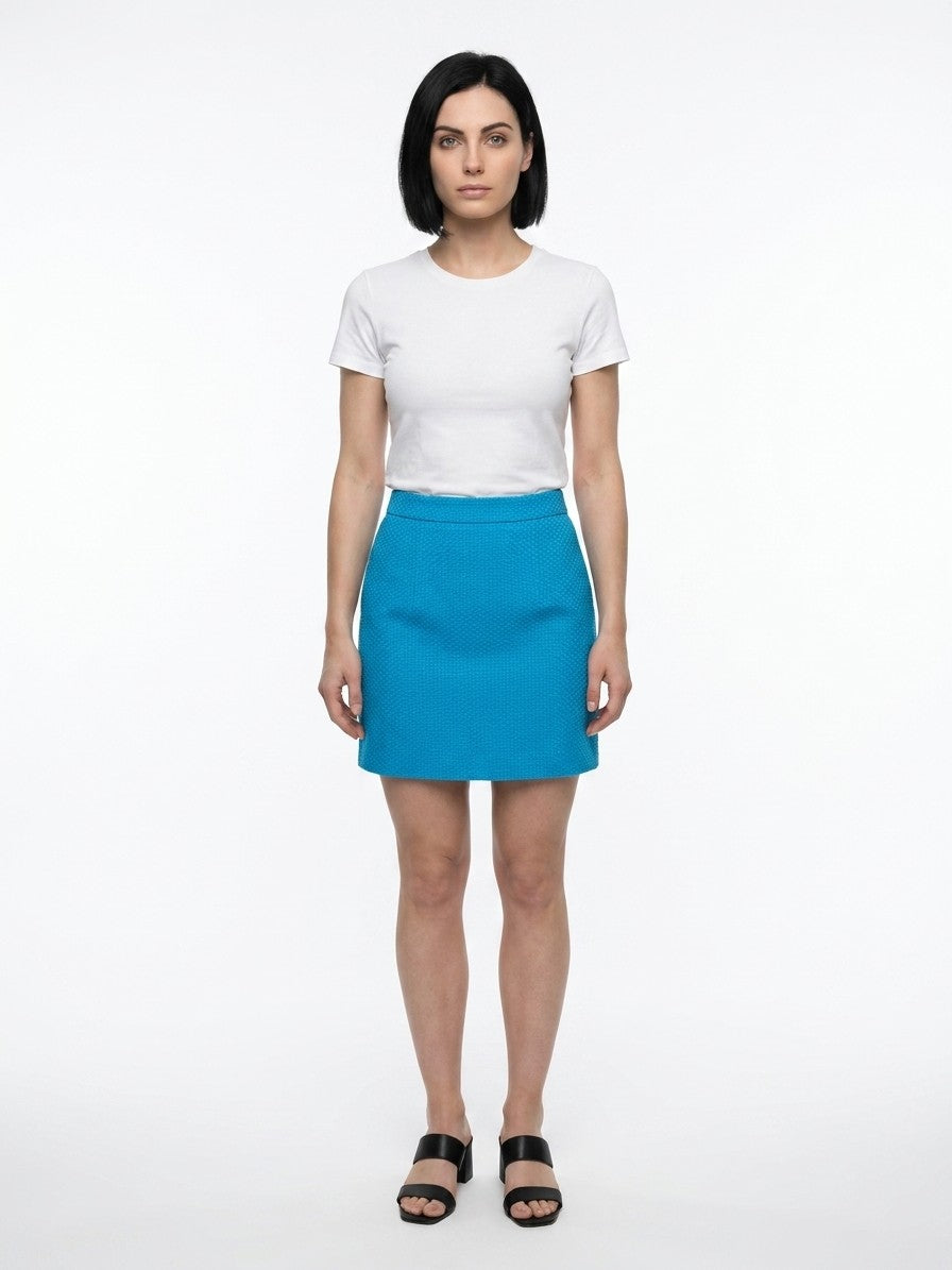 Elevate your style with the Dolce & Gabbana Blue Cotton Mini Skirt, a luxurious blend of cotton and elegance, perfect for the discerning trendsetter.