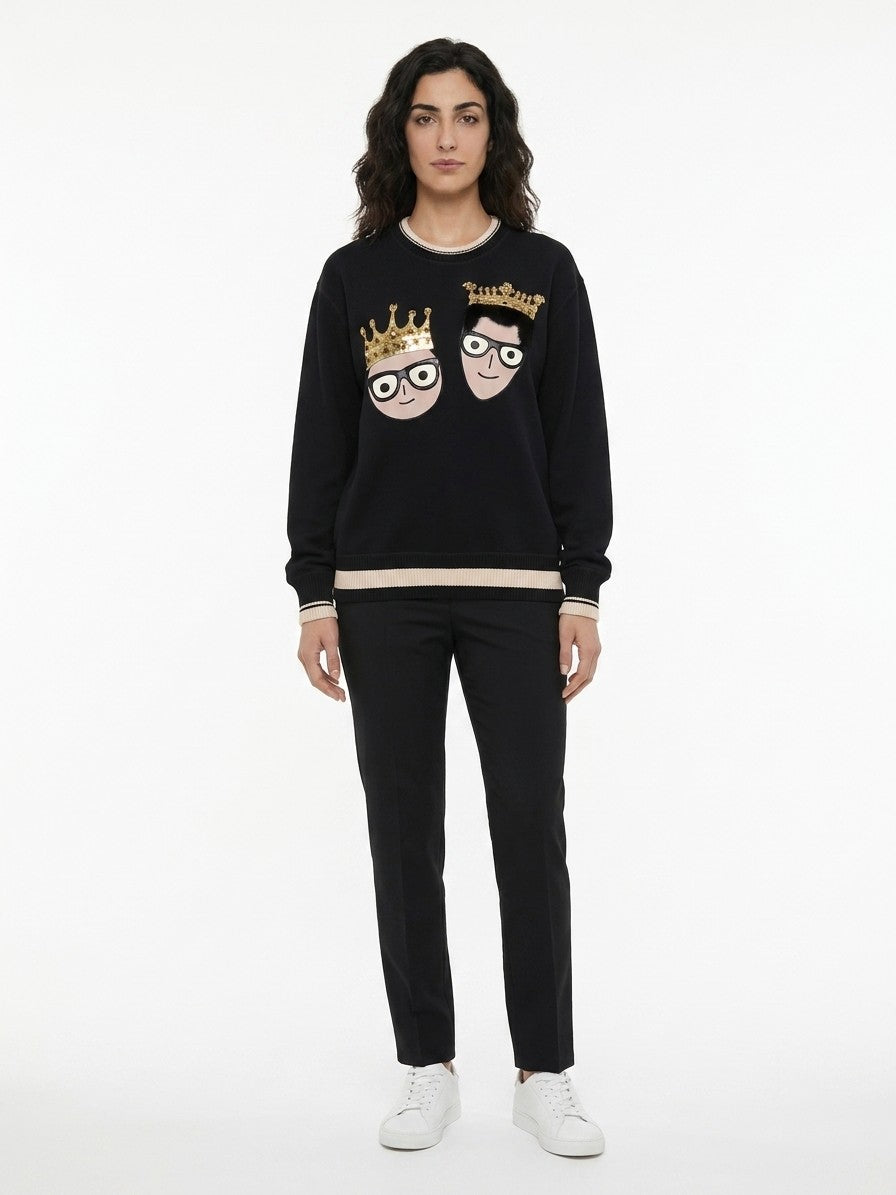 Indulge in the luxurious allure of Dolce & Gabbana's black cotton sweatshirt, a masterpiece of Italian craftsmanship that effortlessly elevates your casual elegance.