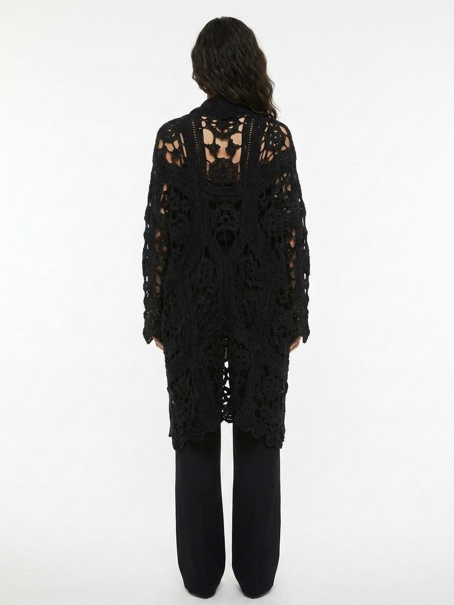 Indulge in the elegance of the Dolce & Gabbana Black Virgin Wool Cardigan, a timeless piece that embodies sophistication and luxurious warmth, perfect for any occasion.