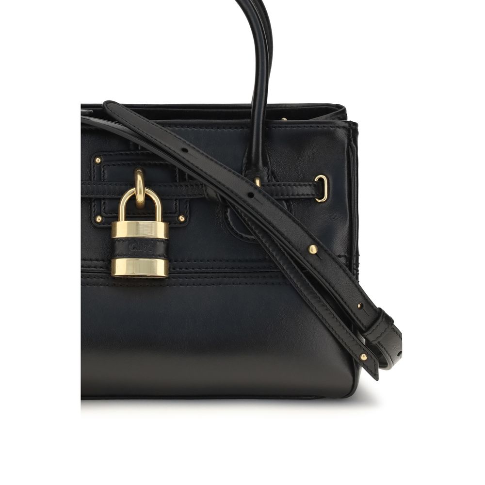 Indulge in the Chloé Black Buffalo Leather Shoulder Bag, a masterpiece of luxurious craftsmanship, celebrating 20 years of timeless elegance in the AW26 collection.