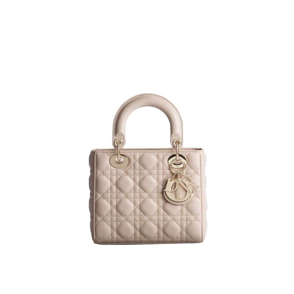 Discover the Dior Beige Lamb Leather Shoulder Bag, a timeless blend of quilted nappa leather and pale gold accents, embodying elegance and sophistication for every occasion.