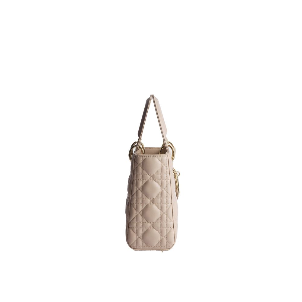Discover the Dior Beige Lamb Leather Shoulder Bag, a masterpiece of quilted nappa leather, blending timeless elegance with luxurious functionality for the discerning individual.