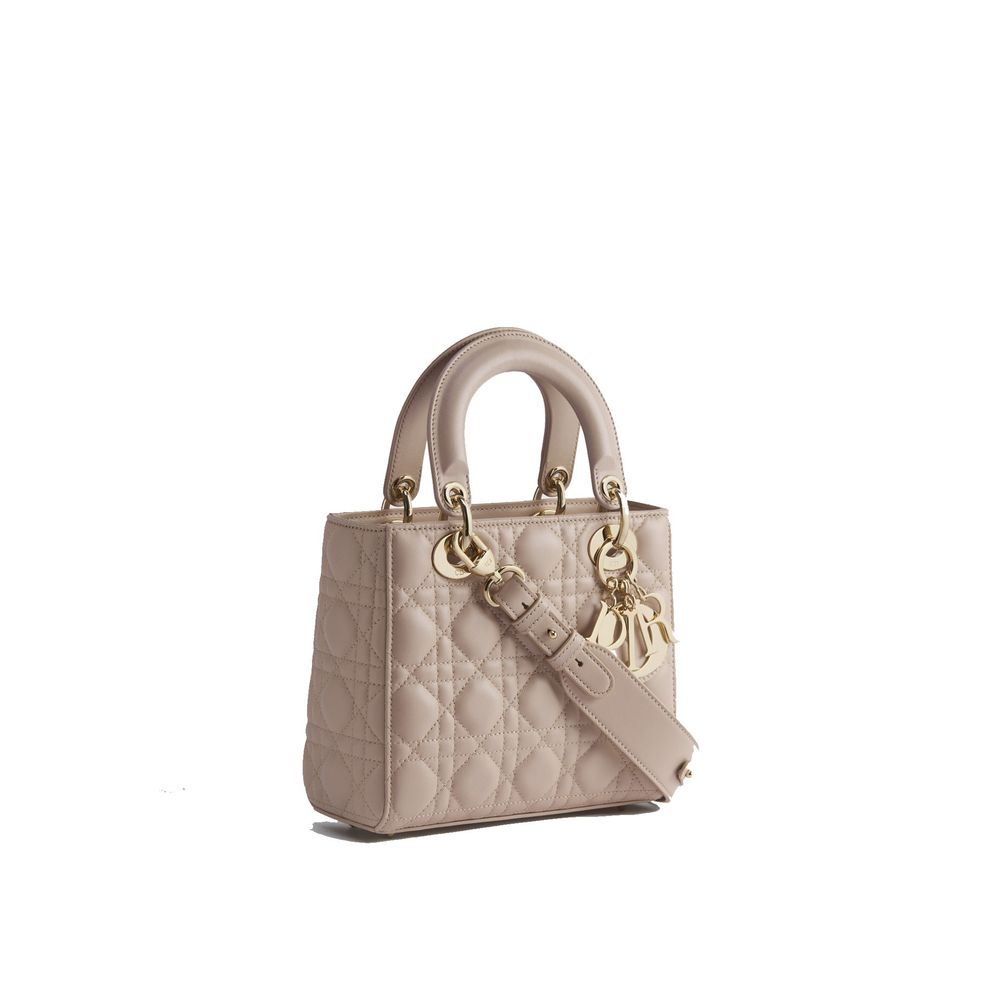 Discover the Dior Beige Lamb Leather Shoulder Bag, a testament to exquisite craftsmanship in 100% lamb leather, elevating your style with timeless elegance and sophistication.