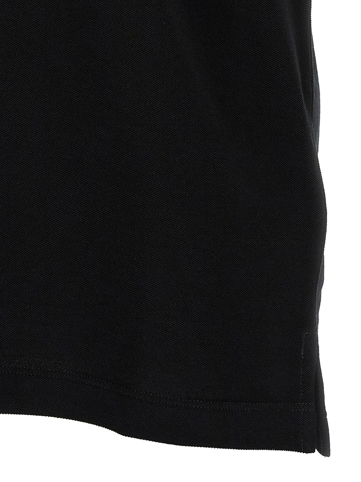 Discover the Fendi Black Cotton Polo Shirt, a luxurious blend of comfort and elegance, embodying Italian craftsmanship for the discerning individual.
