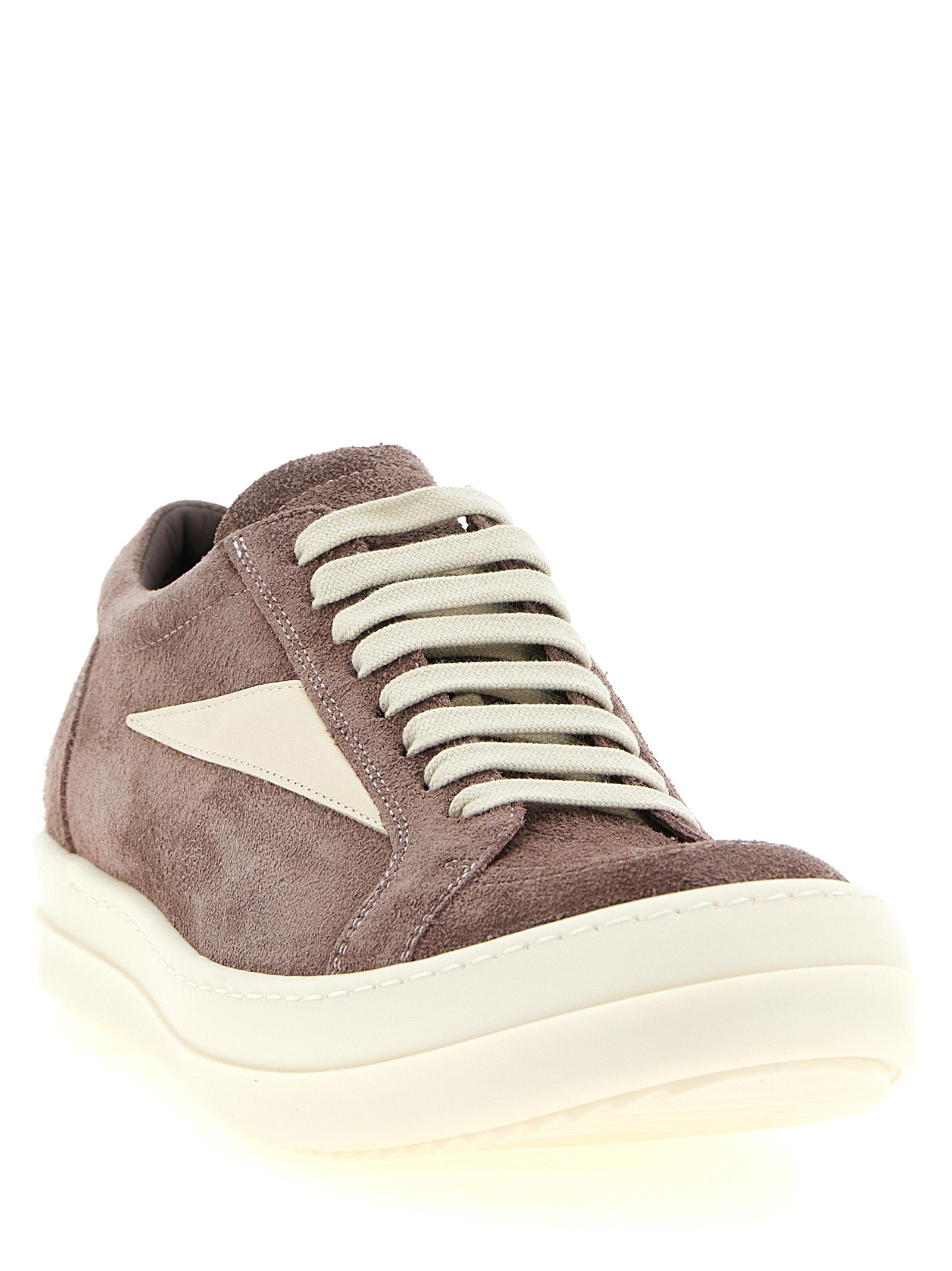 Elevate your style with Rick Owens' Purple Calfskin Low Top Sneakers, a fusion of bold design and luxurious craftsmanship, perfect for the discerning fashion connoisseur.