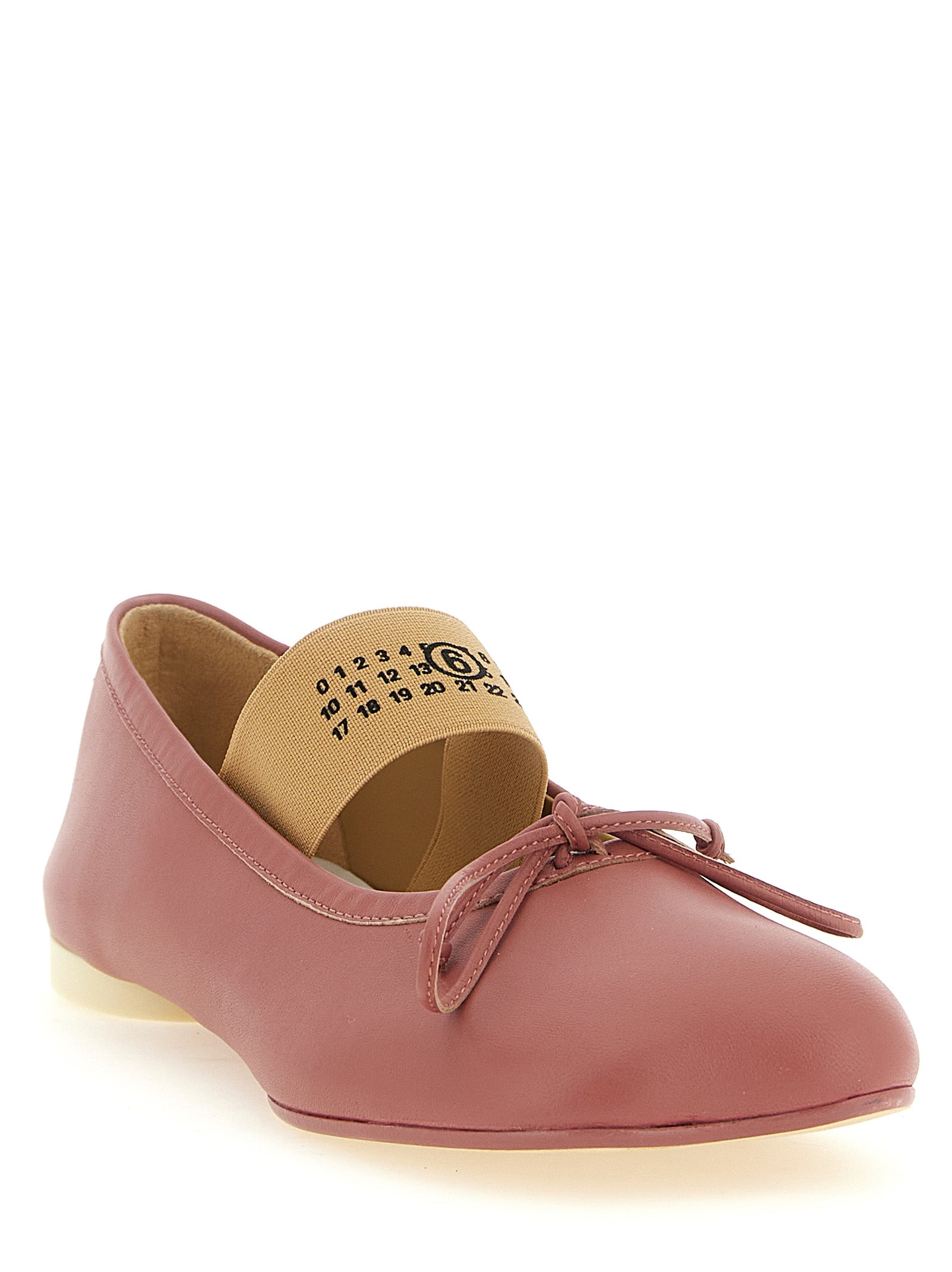 Experience the allure of MM6 Maison Margiela's artisan-crafted lambskin ballet flats, where sophisticated design meets avant-garde elegance for the discerning connoisseur.