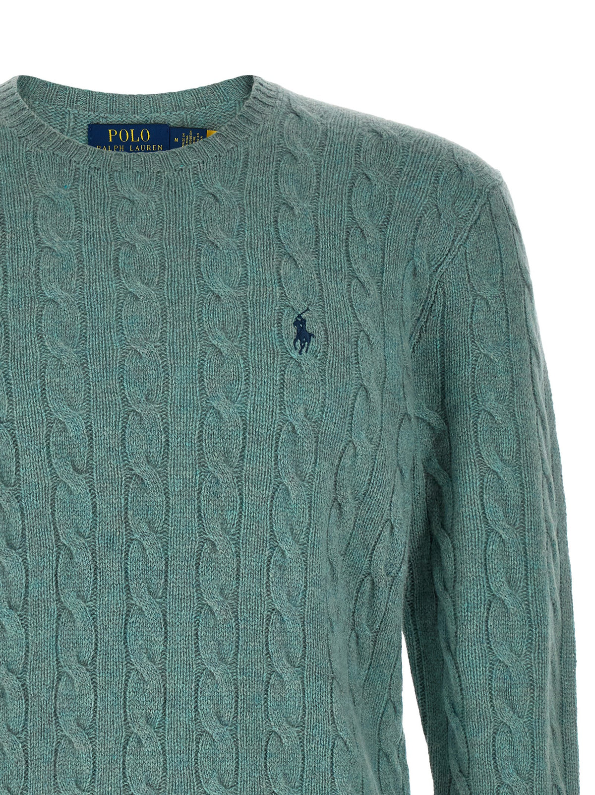 Indulge in the timeless elegance of the Polo Ralph Lauren Bicolor Wool Cardigan, a luxurious blend of wool and cashmere that elevates your knitwear collection with its exquisite craftsmanship and rich teal mélange tone.