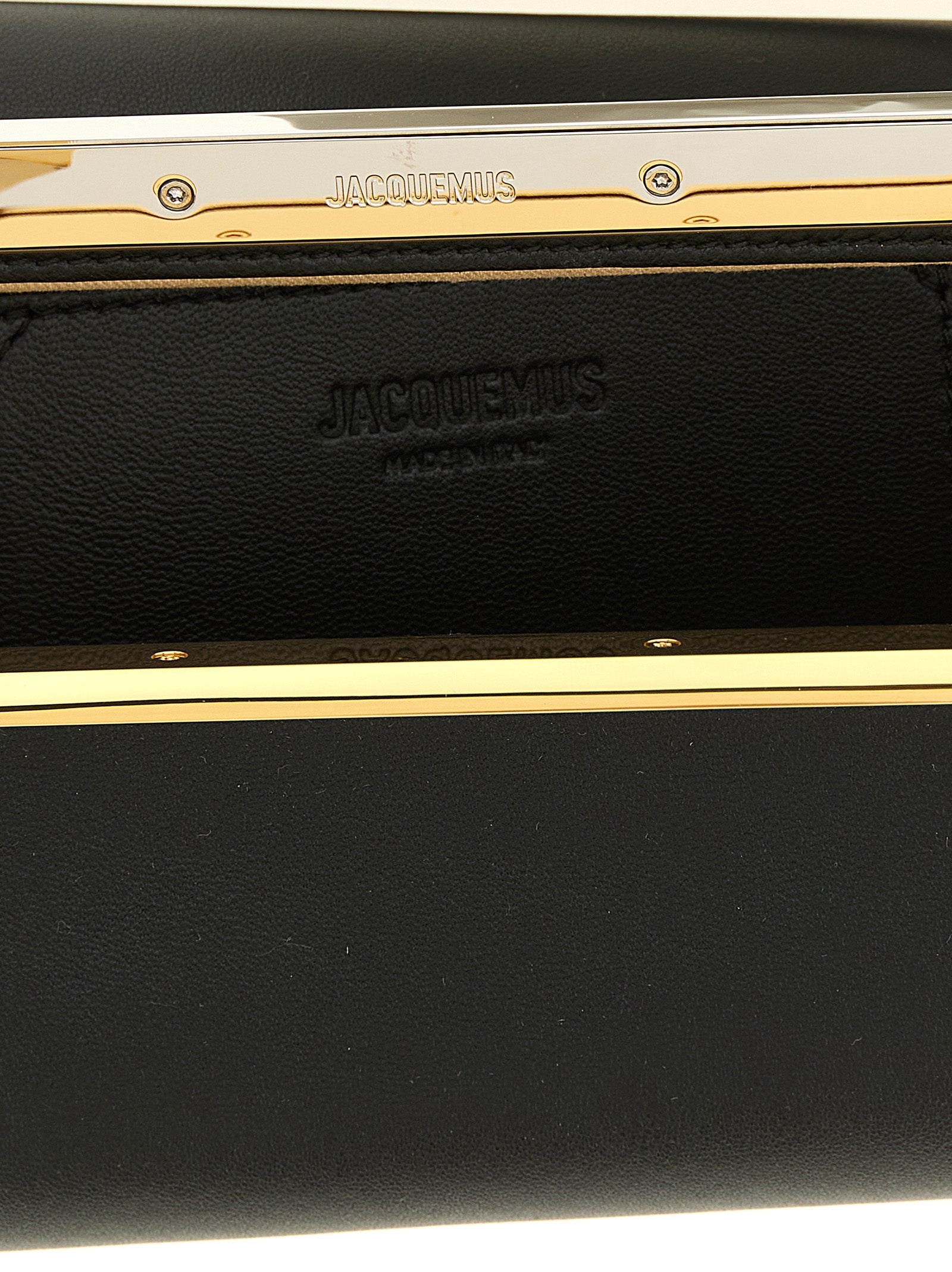 Discover the Jacquemus Black Lamb Leather Clutch, a fusion of elegance and architectural charm, crafted for those who embody sophistication and style.