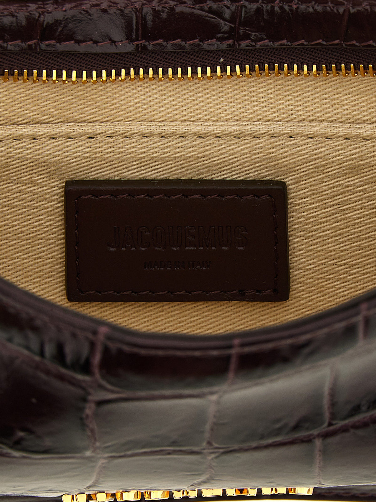 Discover the Jacquemus Bordeaux Calfskin Shoulder Bag, a masterpiece of geometric elegance crafted from luxurious calf leather, embodying sophistication and allure.