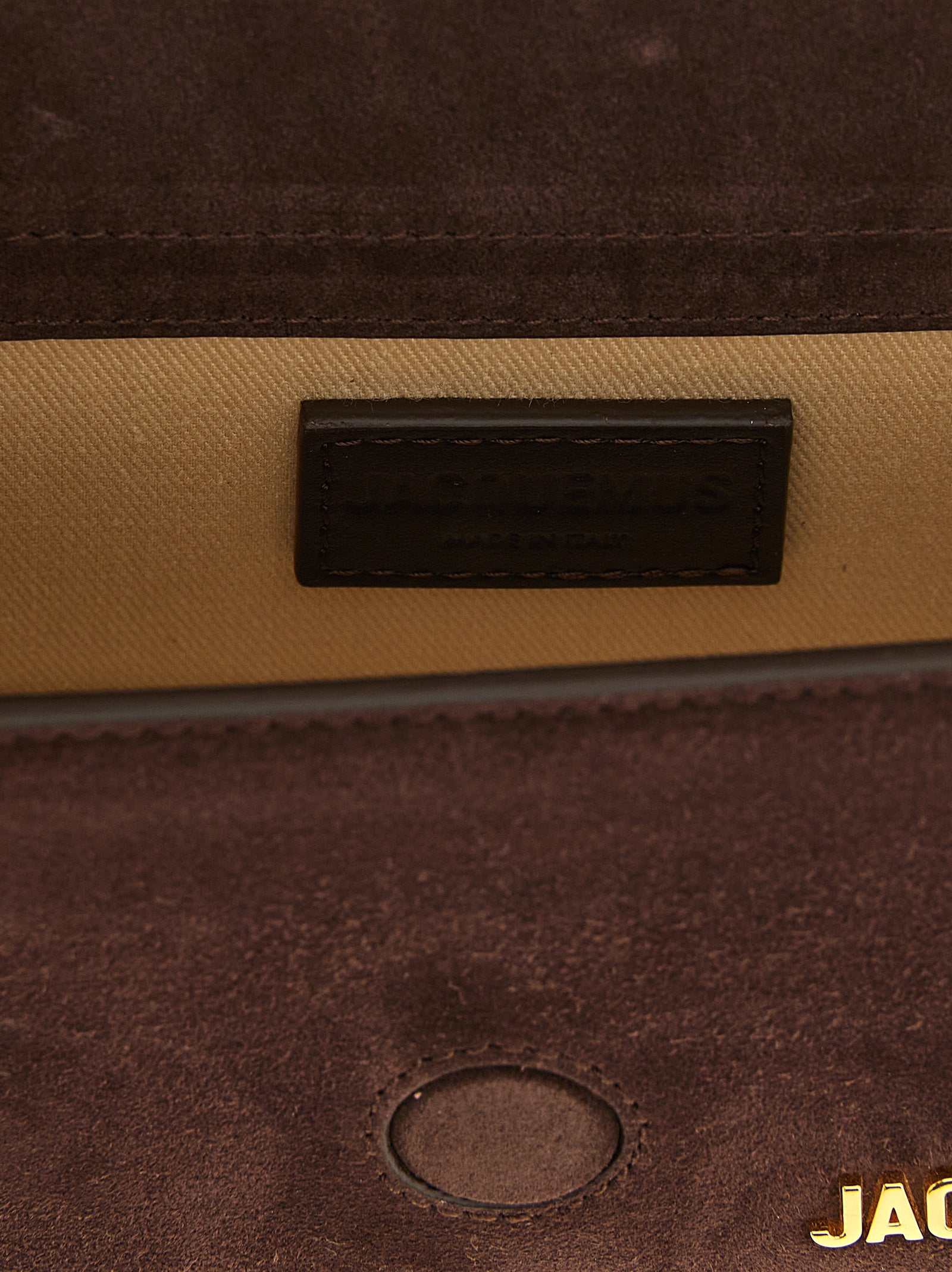 Indulge in the exquisite Jacquemus Brown Calfskin Handbag, a masterpiece of Italian craftsmanship that embodies geometric elegance and sophisticated allure for the discerning connoisseur.
