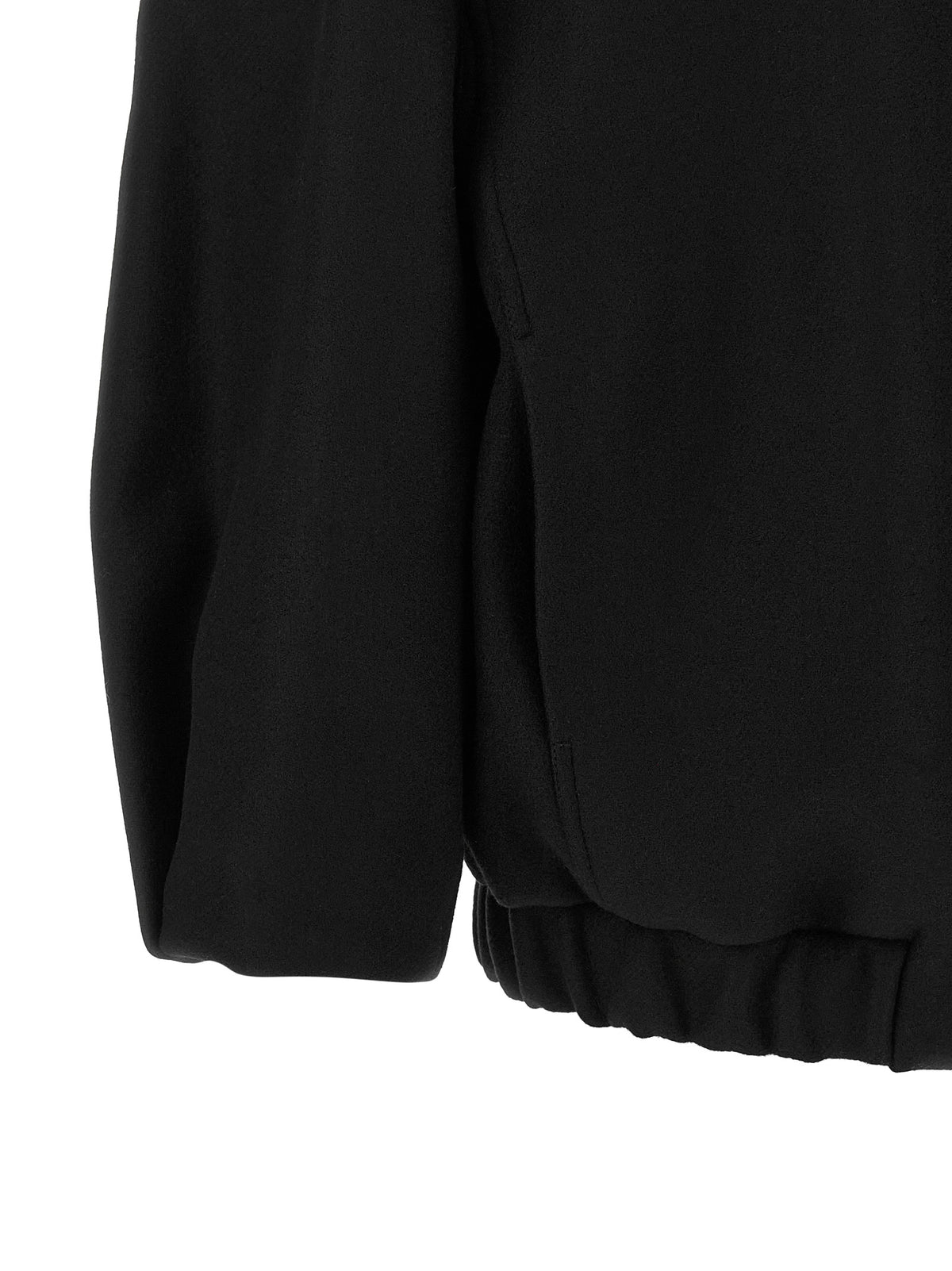 Indulge in the Dries Van Noten Black Wool Bomber, a luxurious blend of wool and polyamide, where avant-garde design meets timeless elegance for the discerning individual.