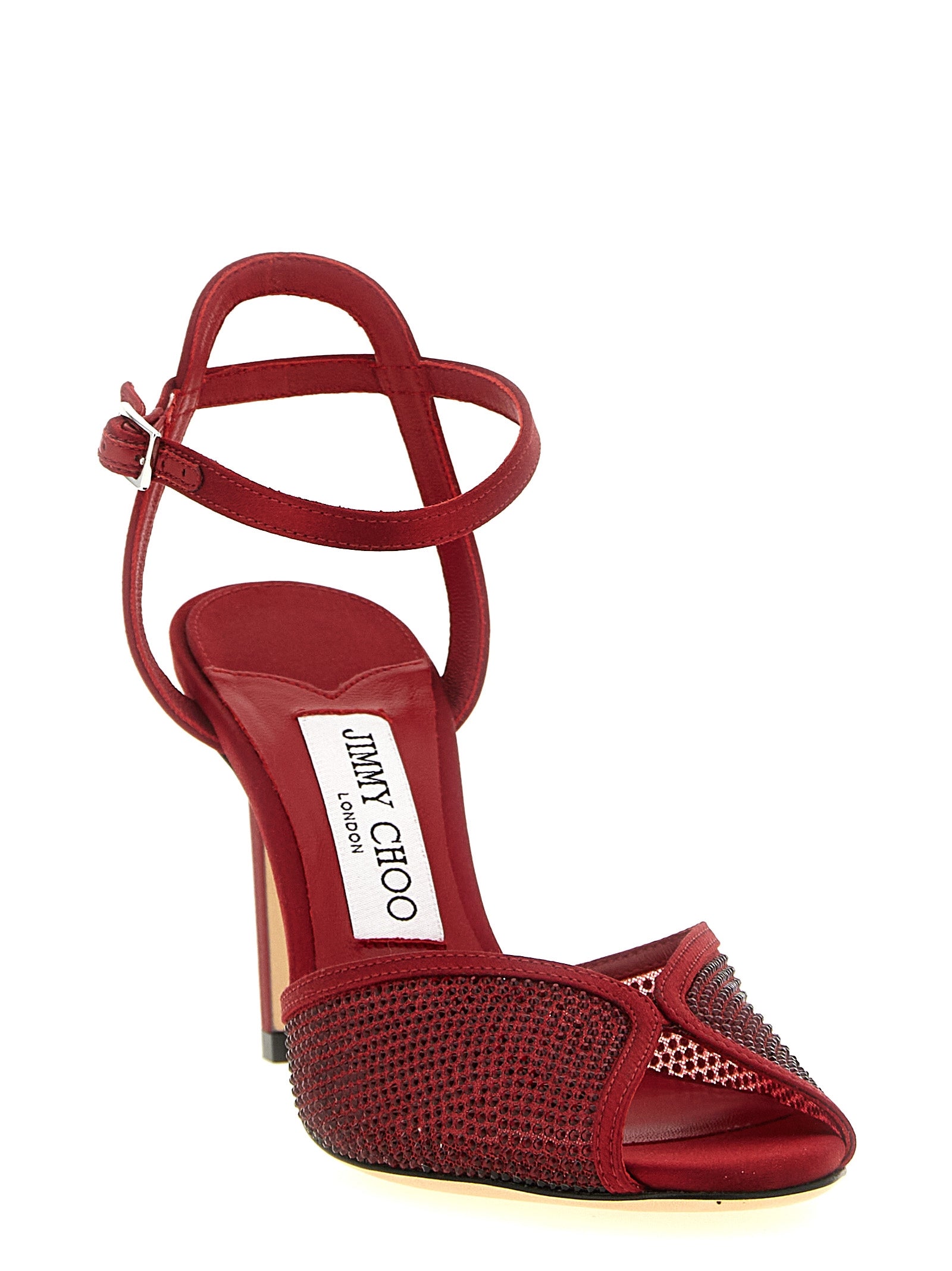 Elevate your elegance with Jimmy Choo's Sacora sandals, crafted in Italy from luxurious lamb leather and adorned with micro crystals, embodying timeless sophistication.