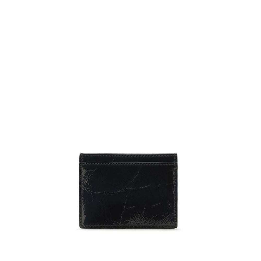 Discover the Vivienne Westwood Black Calf Leather Bos Taurus Wallet, a masterpiece of exquisite craftsmanship in glossy leather, perfect for the discerning individual.