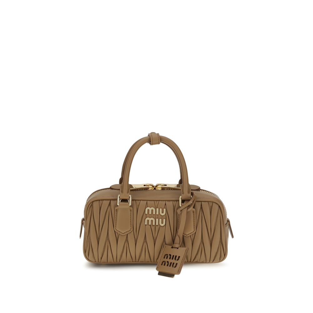 Discover the Miu Miu Beige Calf Leather Bos Taurus Handbag, a timeless luxury piece crafted from exquisite materials, embodying sophistication for the discerning individual.