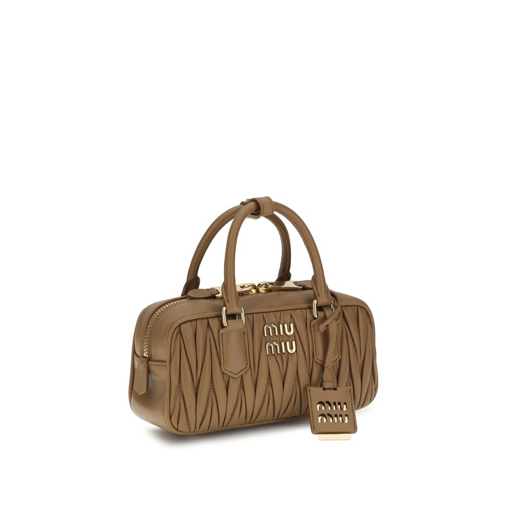 Discover the Miu Miu Beige Calf Leather Bos Taurus Handbag, a timeless masterpiece of luxury and craftsmanship, perfect for elevating your style with sophistication.