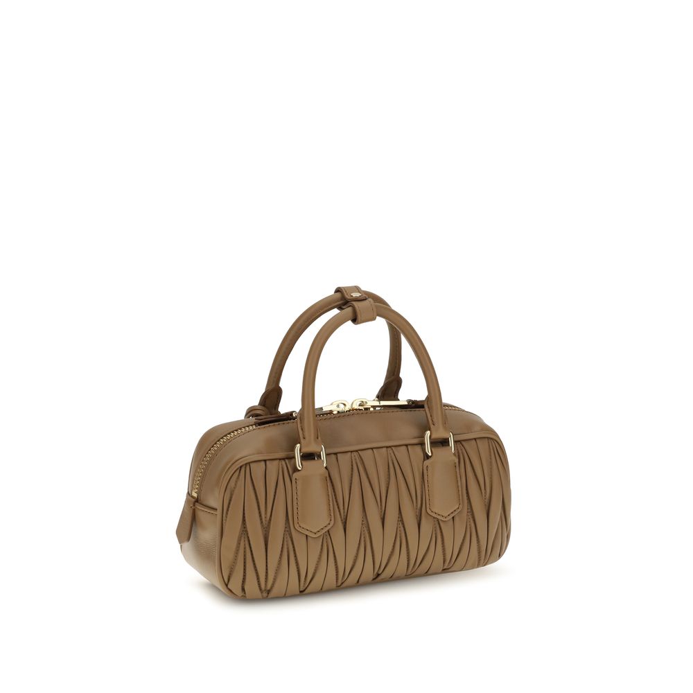 Discover the Miu Miu Beige Calf Leather Bos Taurus Handbag, a timeless piece of luxury crafted from exquisite materials, perfect for elevating any ensemble with sophistication.