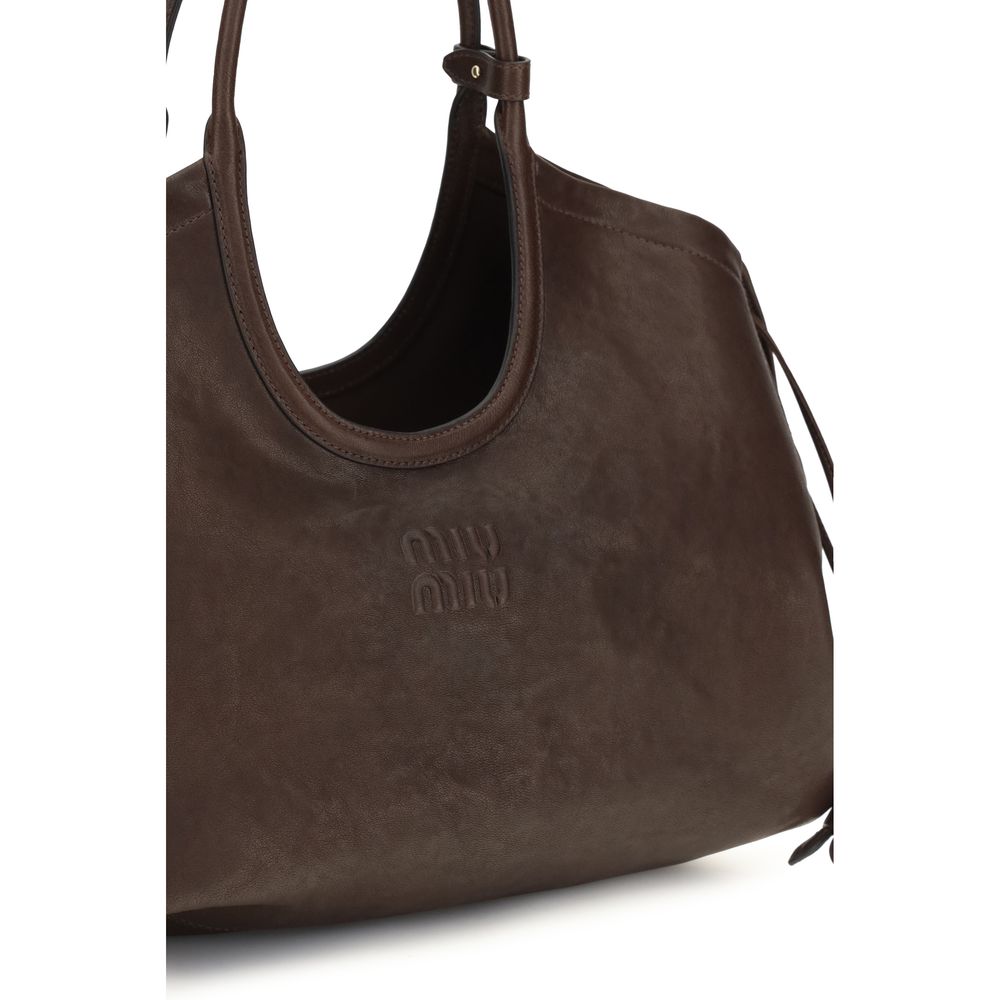 Elevate your style with the Miu Miu Brown Lamb Ovis Aries Handbag, crafted from aged nappa leather, embodying luxurious sophistication for the discerning individual.