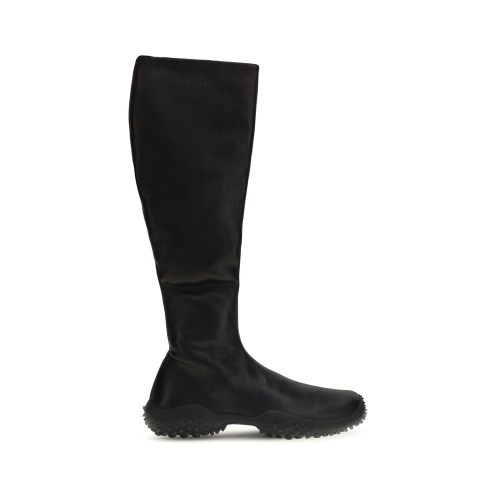 Indulge in the luxurious Miu Miu Black Lamb Ovis Aries Ankle Boots, crafted from soft stretch nappa leather for a sleek silhouette that elevates every ensemble.
