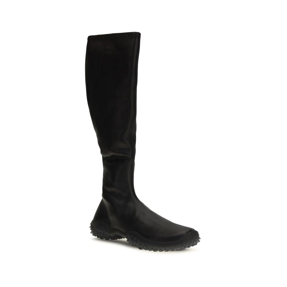 Indulge in the Miu Miu Black Lamb Ovis Aries Ankle Boots, crafted from luxurious soft stretch nappa leather, merging elegance with unmatched comfort for every occasion.