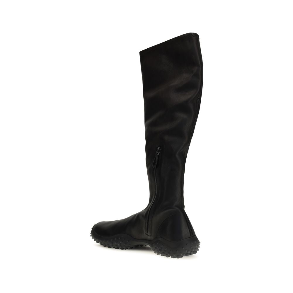 Indulge in the exquisite Miu Miu Black Lamb Ovis Aries Ankle Boots, crafted from luxurious nappa leather for a sleek silhouette that elevates every ensemble.
