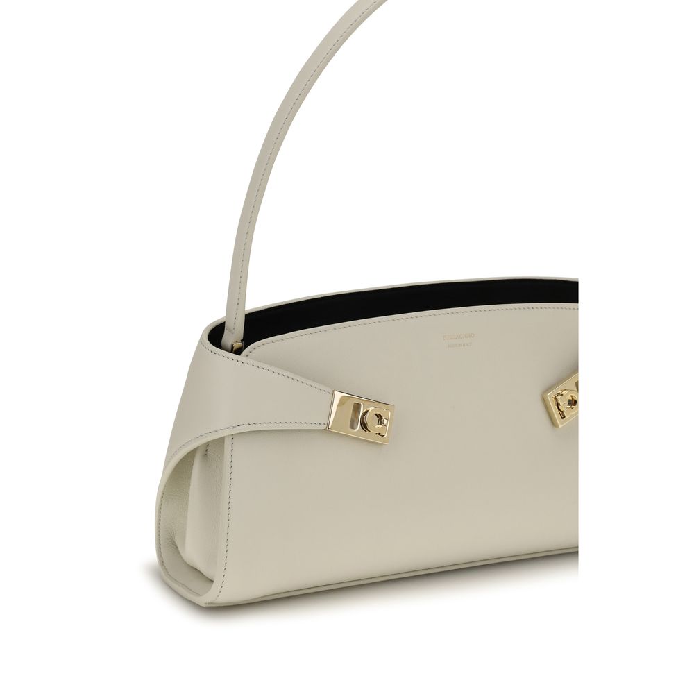 Discover the Ferragamo Beige Calf Leather Bos Taurus Shoulder Bag, a blend of exquisite craftsmanship and timeless elegance, perfect for the discerning individual.