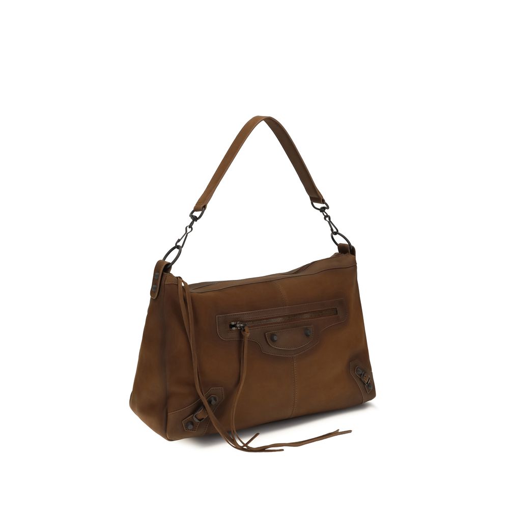 Indulge in the Balenciaga Brown Lamb Ovis Aries Shoulder Bag, a masterpiece of soft Arena lambskin, blending timeless elegance with modern sophistication for the discerning individual.