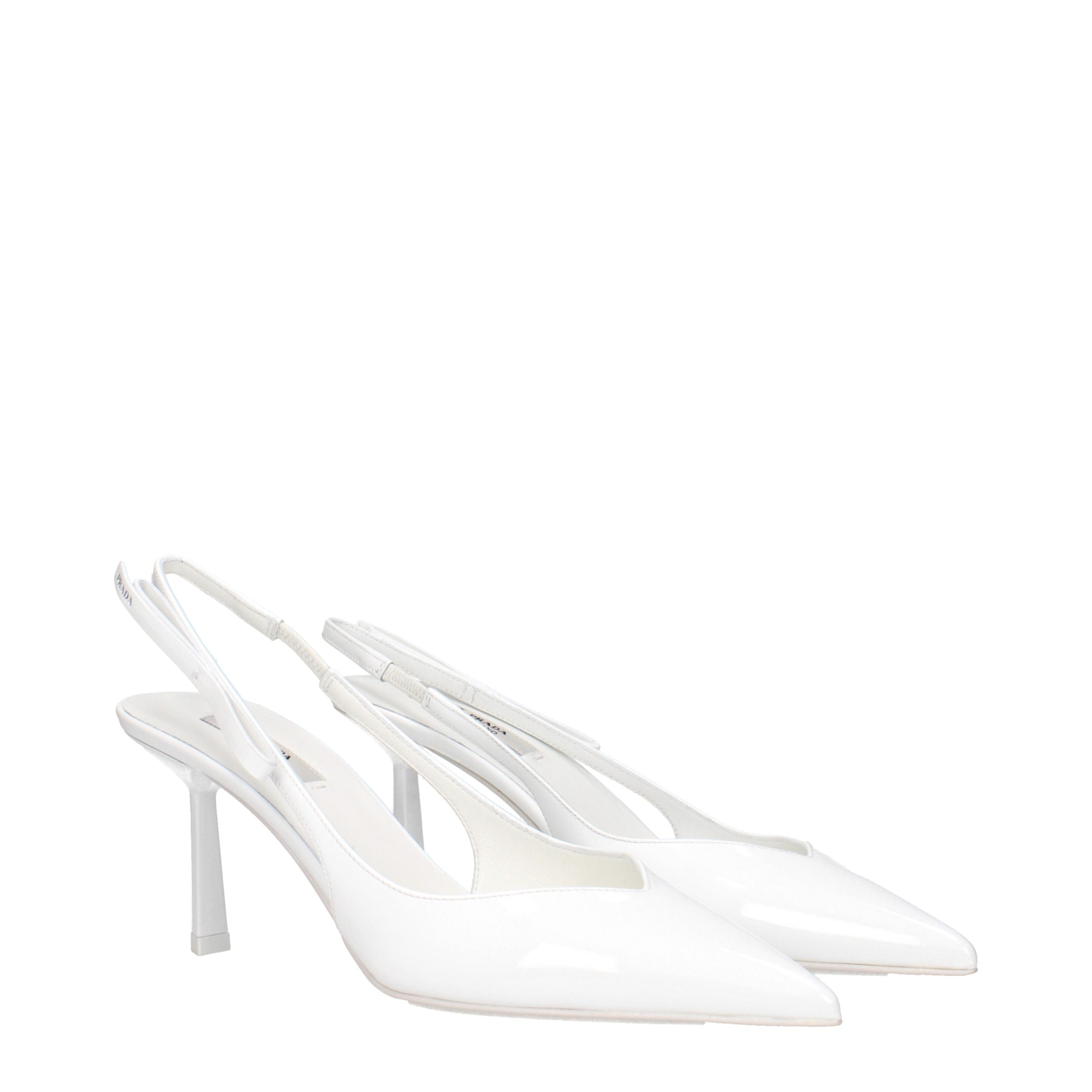 Elevate your elegance with Prada White Leather High Heel Pumps, crafted from luxurious patent leather for a timeless allure that embodies sophistication and style.