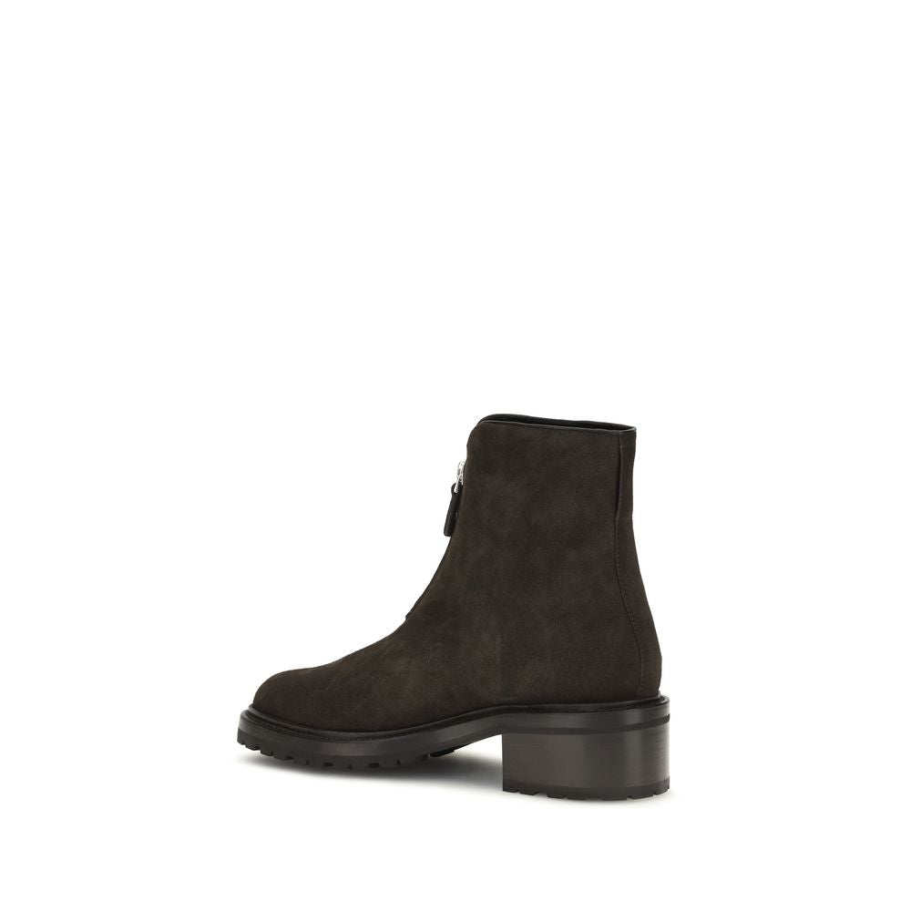 Indulge in The Row's Brown Suede Leather Ankle Boots, where exquisite craftsmanship meets timeless elegance, elevating your style for every occasion.