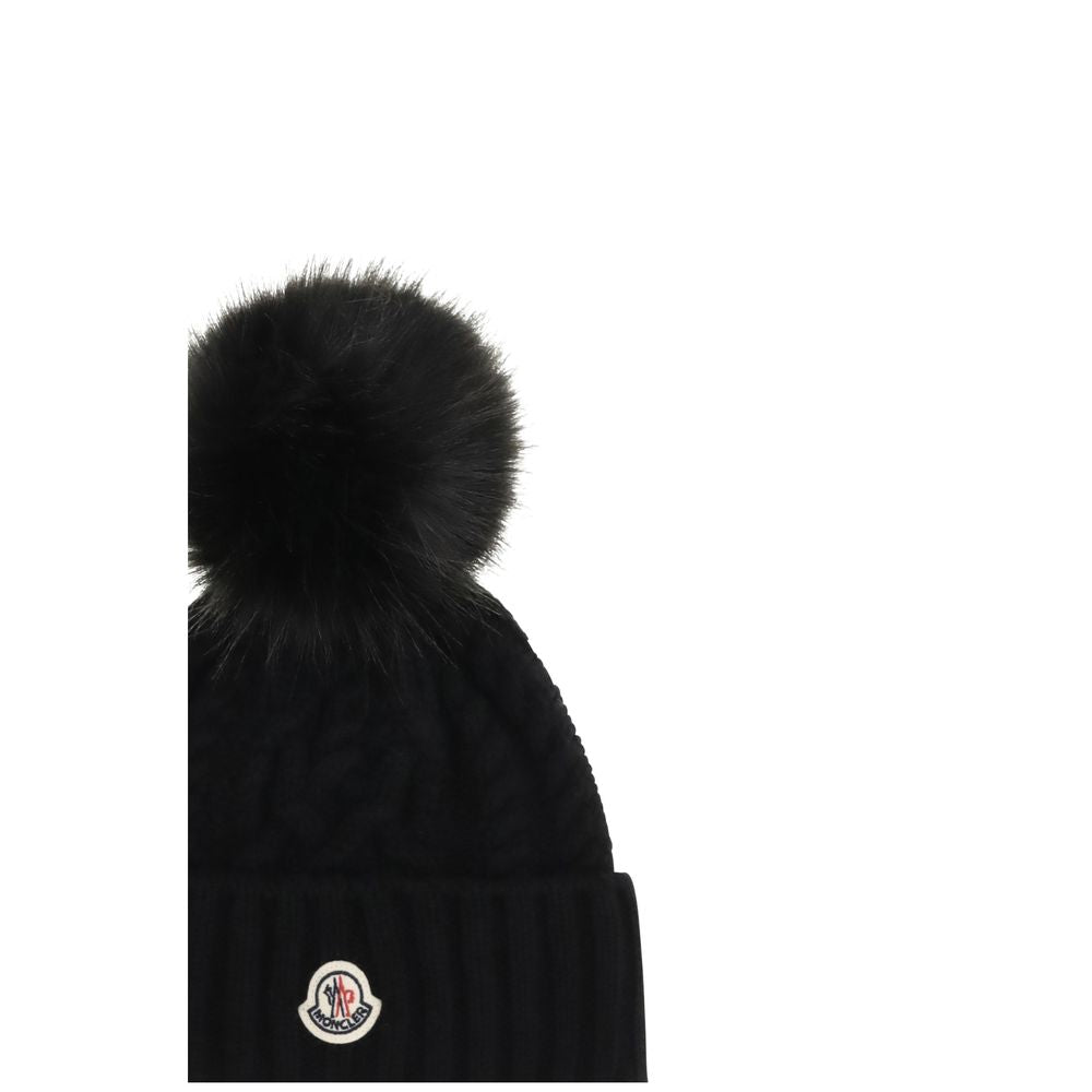 Indulge in the Moncler Black Wool Oves Aries Beanie, a luxurious blend of fleece wool and cashmere, crafted for warmth and elegance in winter's embrace.