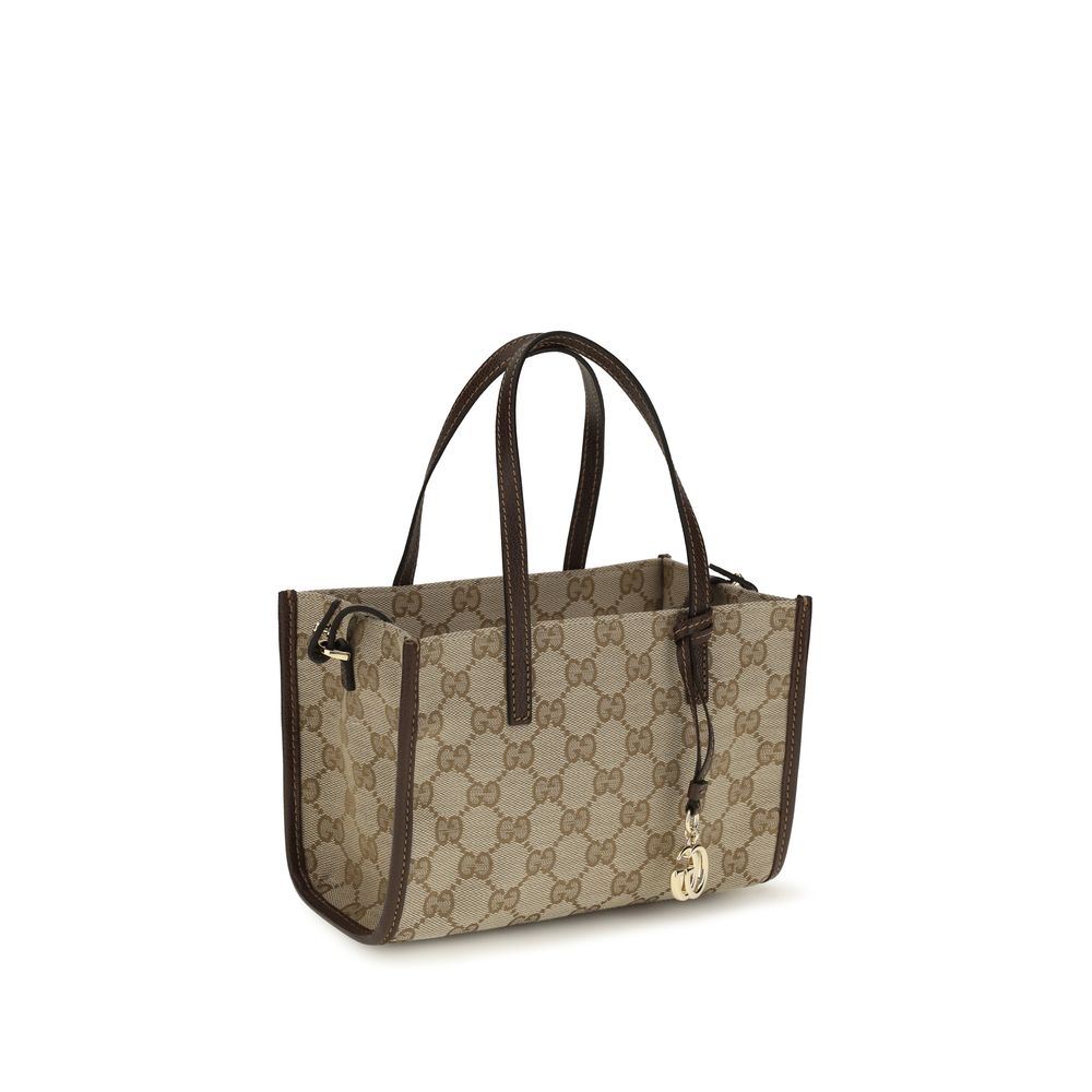 Elevate your style with the Gucci Beige Cotton Shoulder Bag, a luxurious blend of craftsmanship and elegance, perfect for any occasion.