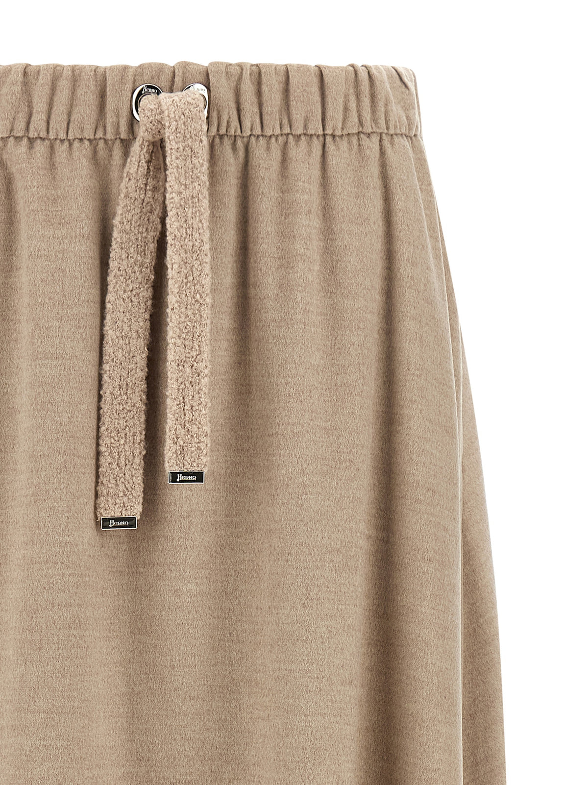 Discover the Herno Beige Polyester Midi Skirt, a luxurious A-line silhouette crafted from a sumptuous blend of materials, embodying refined elegance and timeless sophistication.