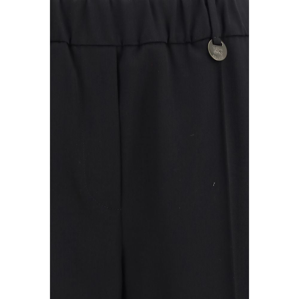Indulge in the exquisite Burberry Black Wool Oves Aries Joggers, crafted from luxurious Merino wool twill, embodying timeless elegance and unparalleled comfort for the discerning individual.