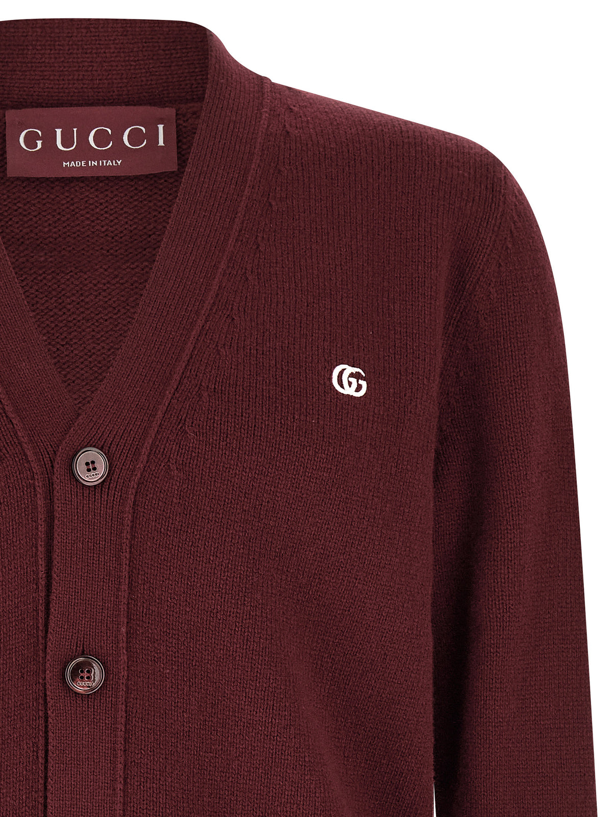 Indulge in the exquisite Gucci Bordeaux Cashmere Cardigan, a masterpiece of Italian craftsmanship that embodies timeless elegance and sophistication for the discerning individual.