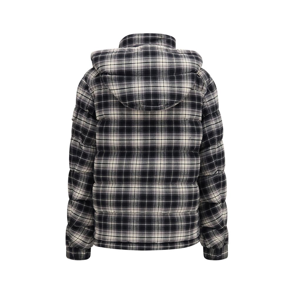 Indulge in the Moncler Black Cotton Full-Length Jacket, where exquisite craftsmanship meets luxurious comfort, perfect for the discerning individual who values elegance and warmth.