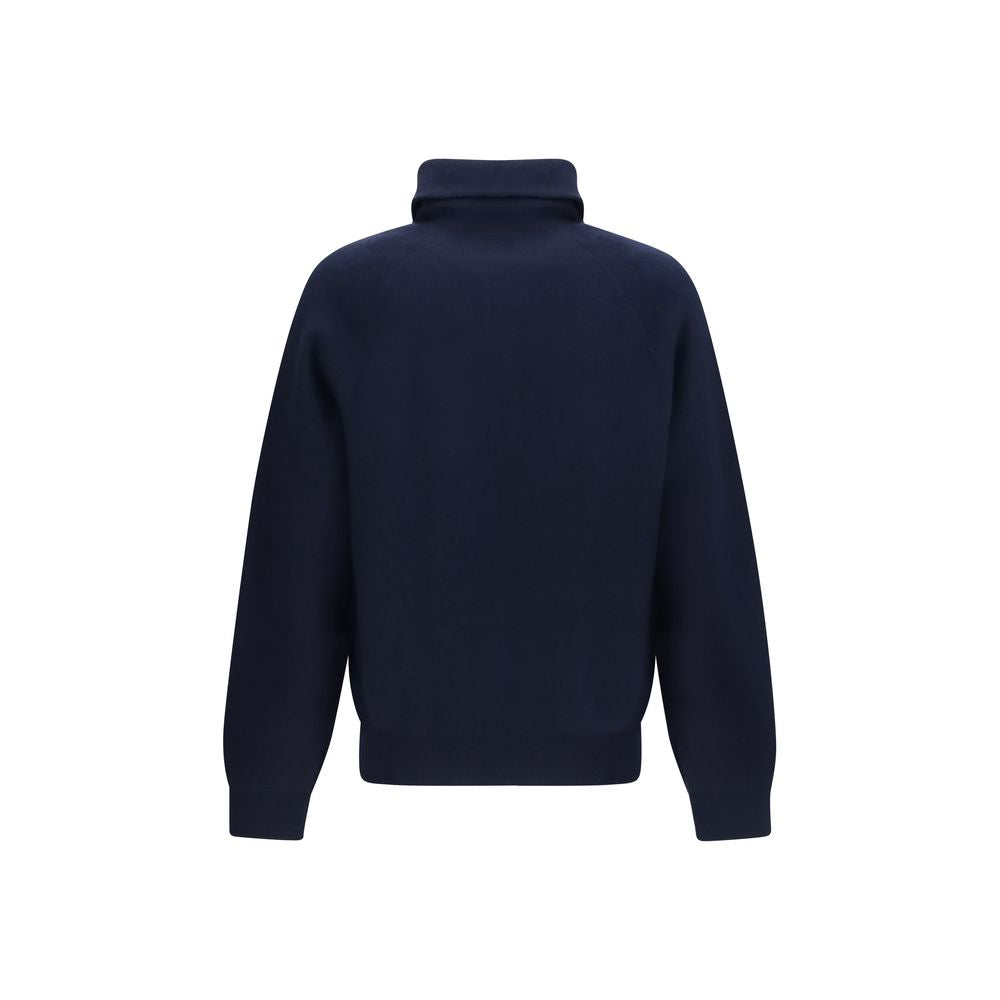 Experience the exquisite allure of the Prada Blue Wool Oves Aries Polo Shirt, crafted from luxurious fleece wool and cashmere for a sophisticated, oversized silhouette that redefines elegance.
