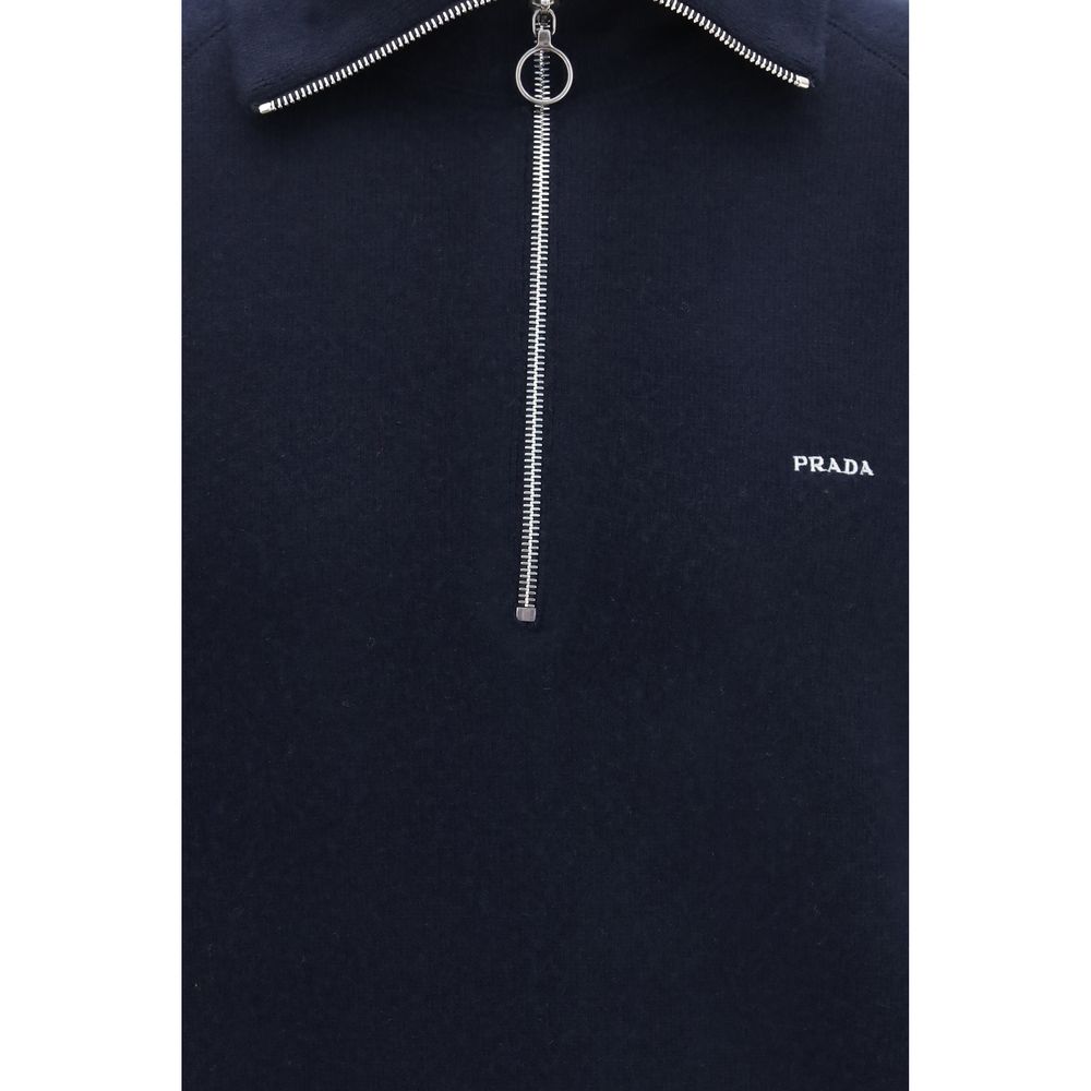 Experience the refined elegance of the Prada Blue Wool Oves Aries Polo Shirt, crafted from luxurious fleece wool and cashmere for a sophisticated, oversized silhouette that redefines modern luxury.