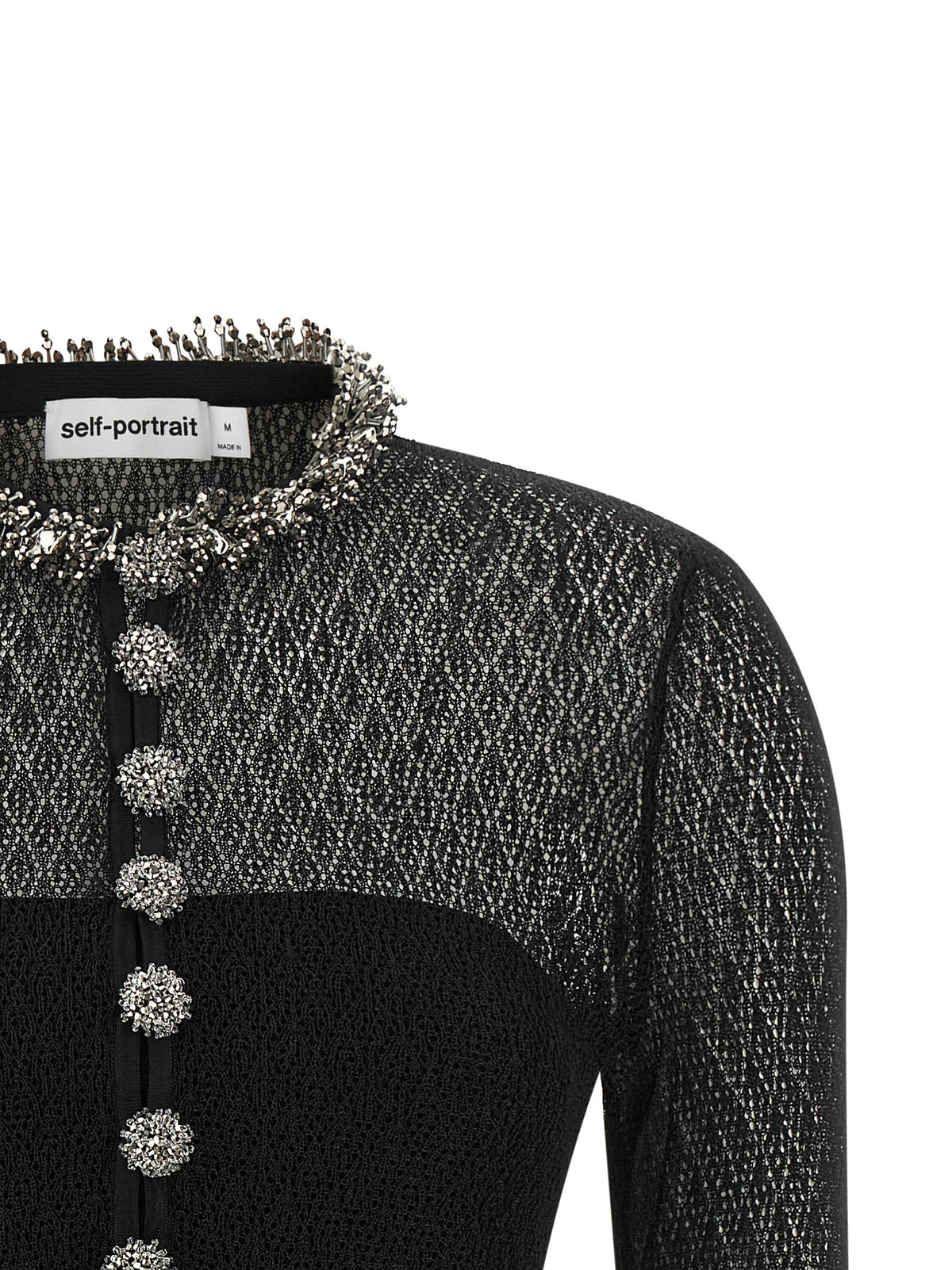 Indulge in the exquisite allure of the Self-Portrait Black Viscose Tank Top, a masterpiece of meticulous craftsmanship that embodies luxury and sophistication for the modern connoisseur.