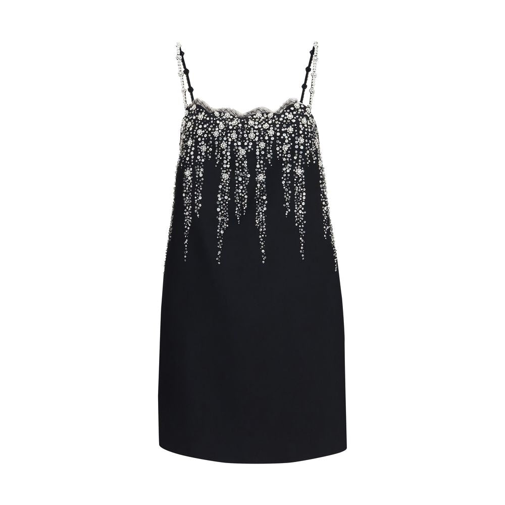 Indulge in the exquisite Valentino Garavani Black Wool Oves Aries Cocktail Dress, a masterpiece of floral embroidery and silk blend, embodying timeless elegance for discerning tastes.