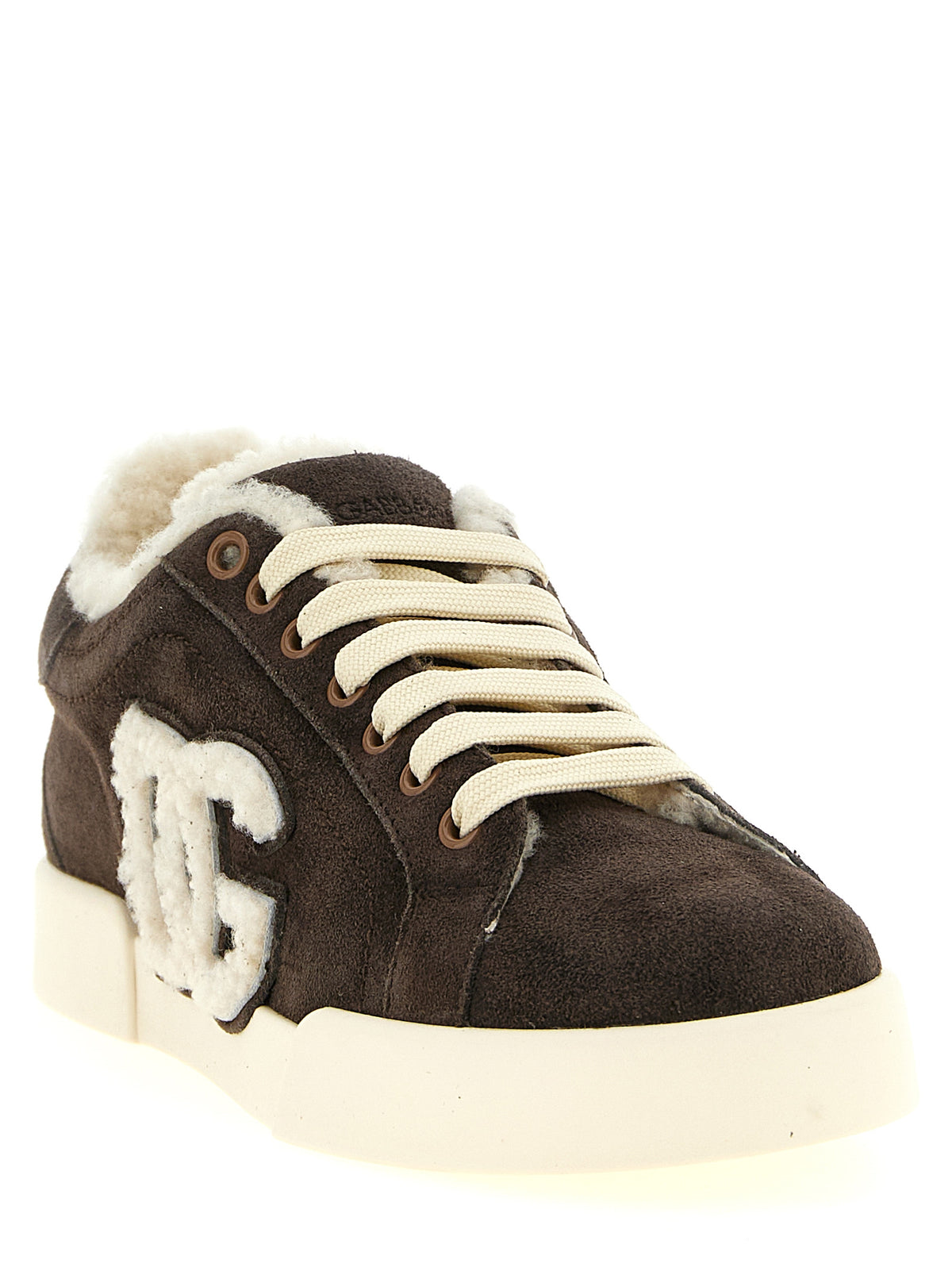 Indulge in the exquisite Dolce & Gabbana Brown Calfskin Low Top Sneakers, where sumptuous suede meets unparalleled craftsmanship, elevating your everyday elegance.