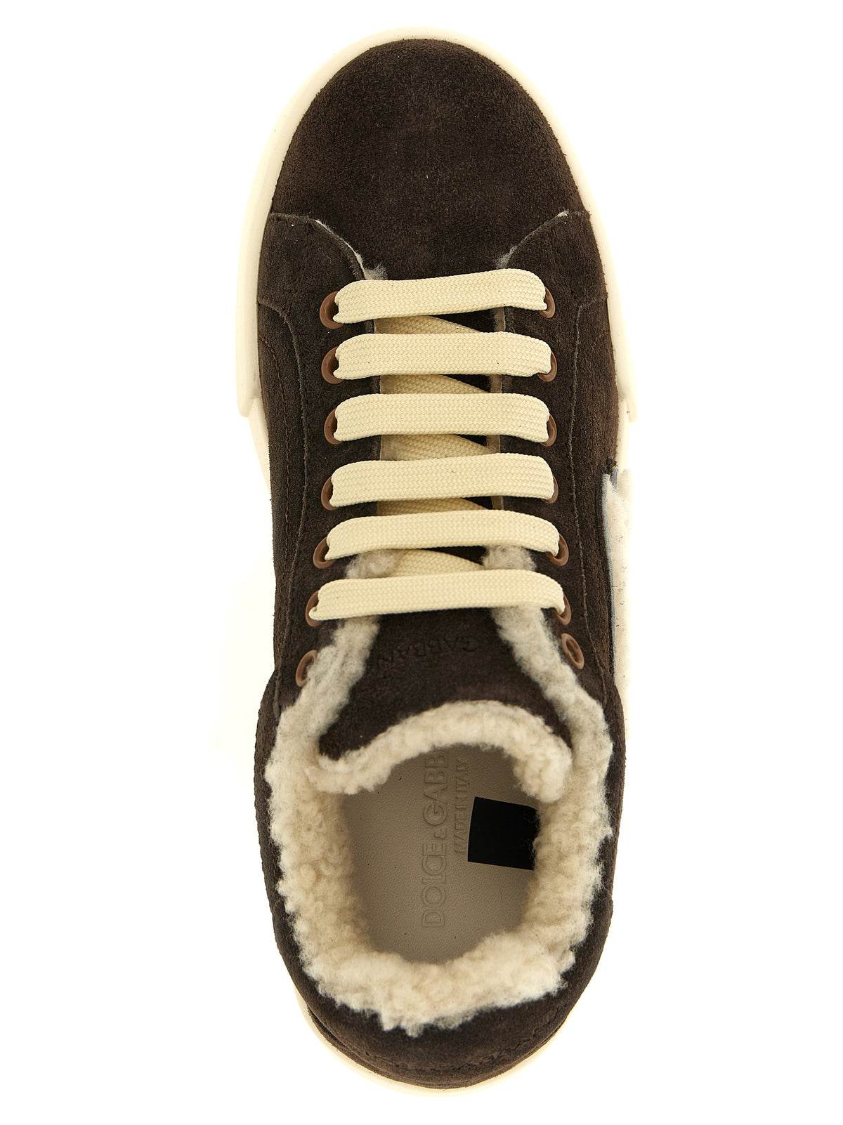 Indulge in the exquisite Dolce & Gabbana Brown Calfskin Low Top Sneakers, where luxurious suede meets impeccable craftsmanship, elevating your style with effortless elegance.