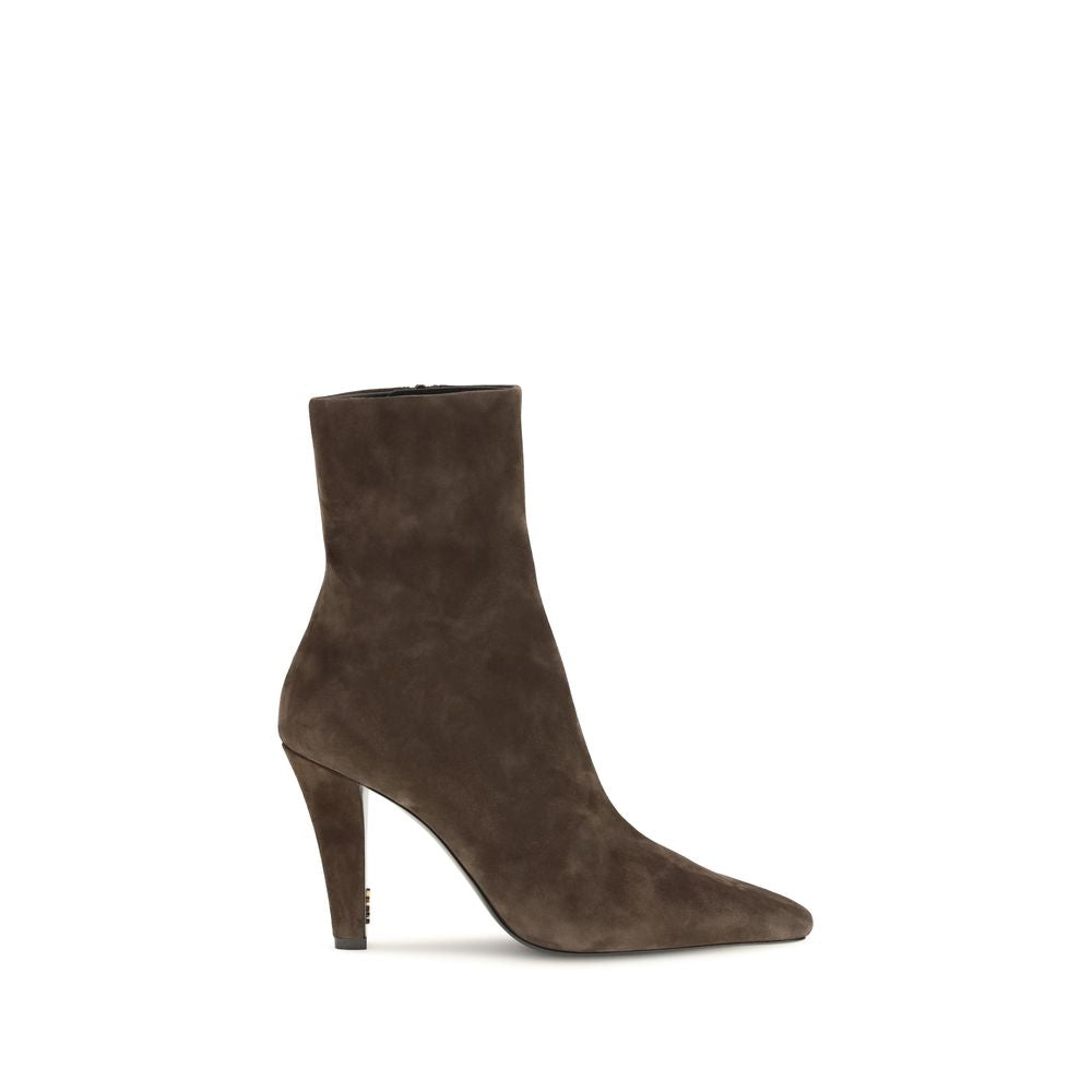 Experience the allure of Saint Laurent's Brown Calf Leather Bos Taurus Ankle Boots, where exquisite craftsmanship meets timeless elegance, perfect for the discerning connoisseur.