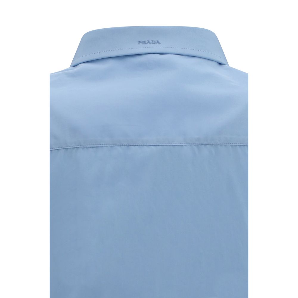 Experience the allure of the Prada Blue Cotton Dress Shirt, a masterpiece of exquisite craftsmanship and timeless elegance, perfect for any sophisticated wardrobe.