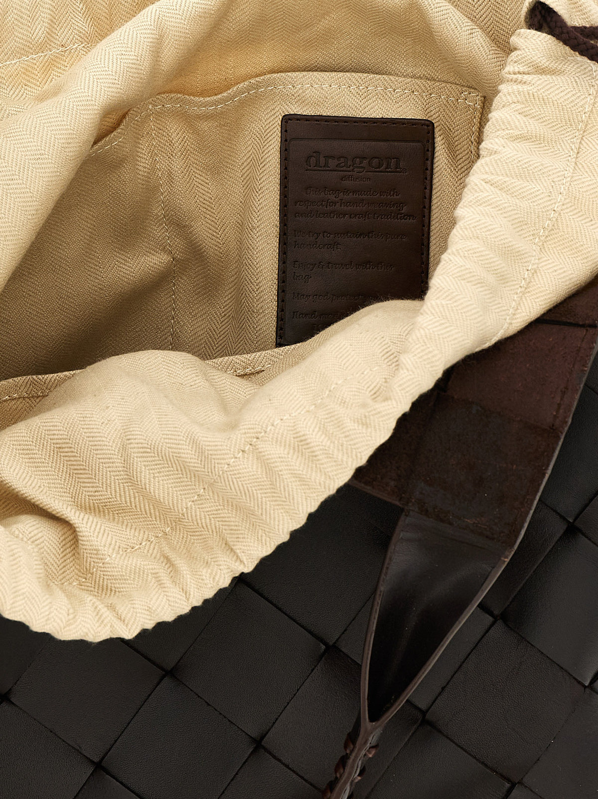 Elevate your style with the Dragon Diffusion Brown Calfskin Shoulder Bag, a testament to artisanal excellence and timeless luxury, perfect for any sophisticated occasion.