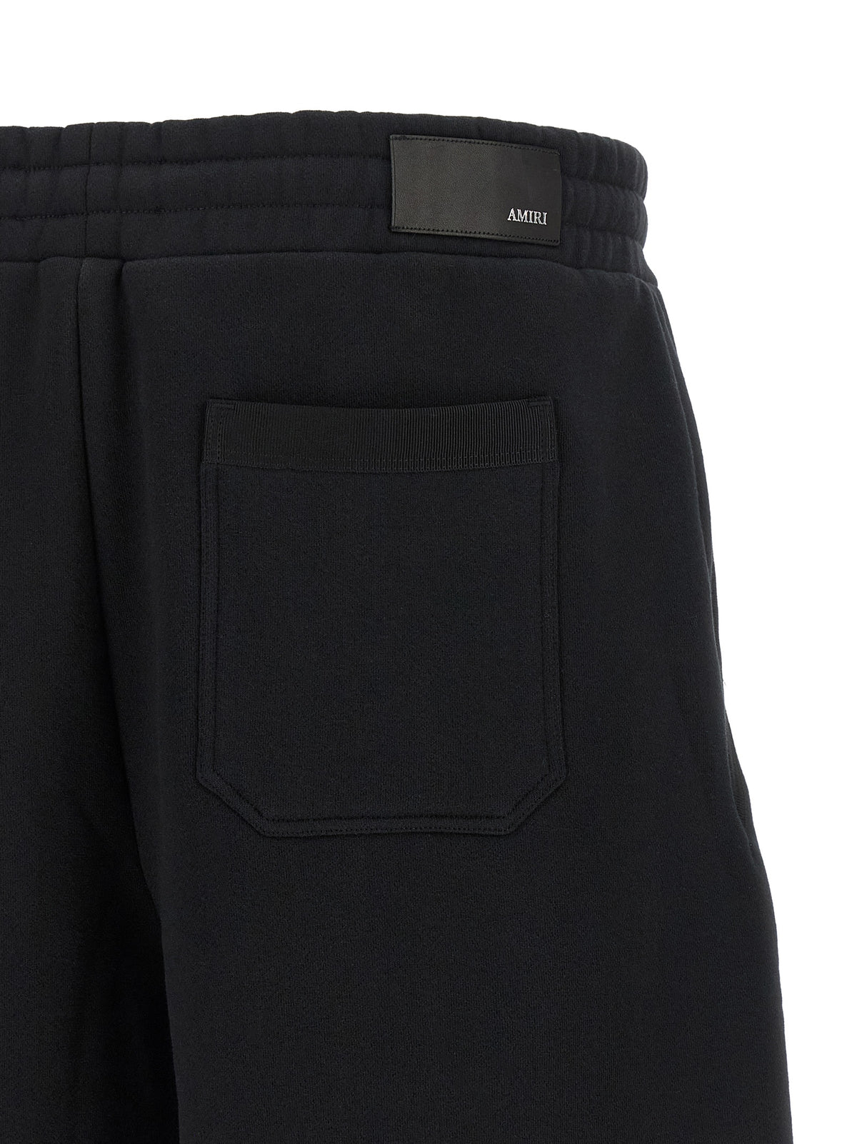 Indulge in the Amiri Black Cotton Bermuda Shorts, where Italian craftsmanship meets relaxed elegance, embodying luxury for the discerning individual.