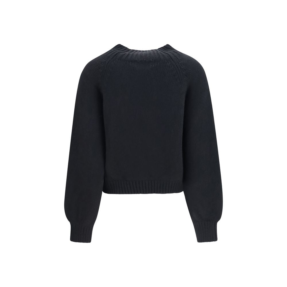 Indulge in the refined elegance of the Khaite Black Cashmere Sweatshirt, crafted from luxurious Italian cashmere, embodying sophistication and timeless allure.